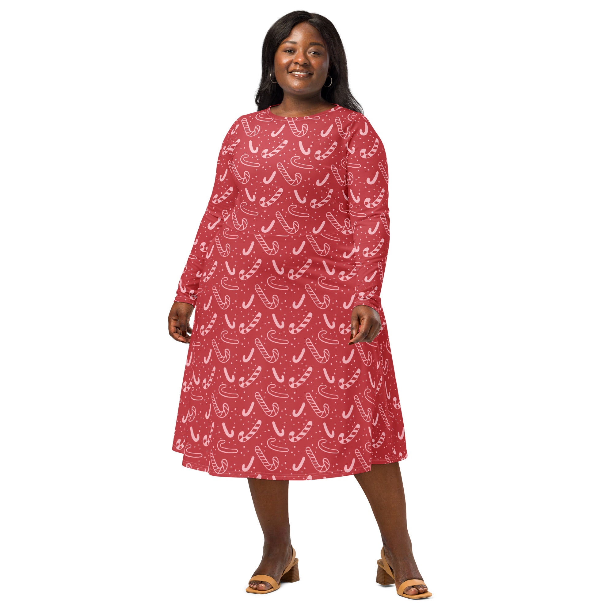 Women’s red candy cane Christmas long sleeve midi dress with pockets featuring a festive candy cane pattern