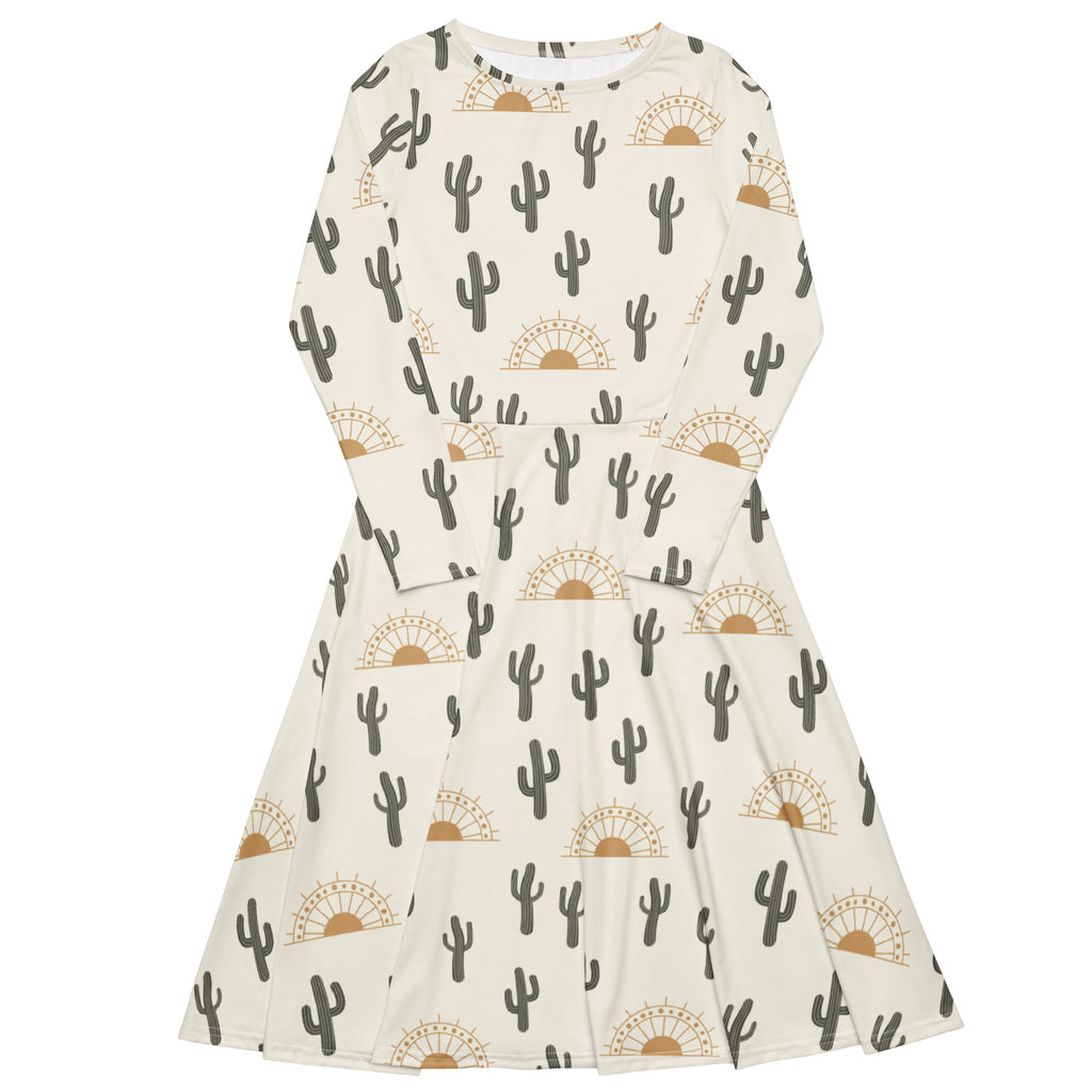 Women’s cream-colored long sleeve midi dress with black cactus and tan sunburst patterns and pockets