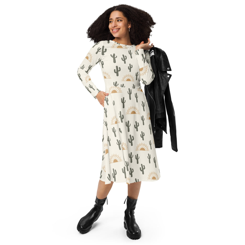 Women’s off-white long sleeve midi dress with black cactus and gold sun pattern and pockets in lightweight fabric