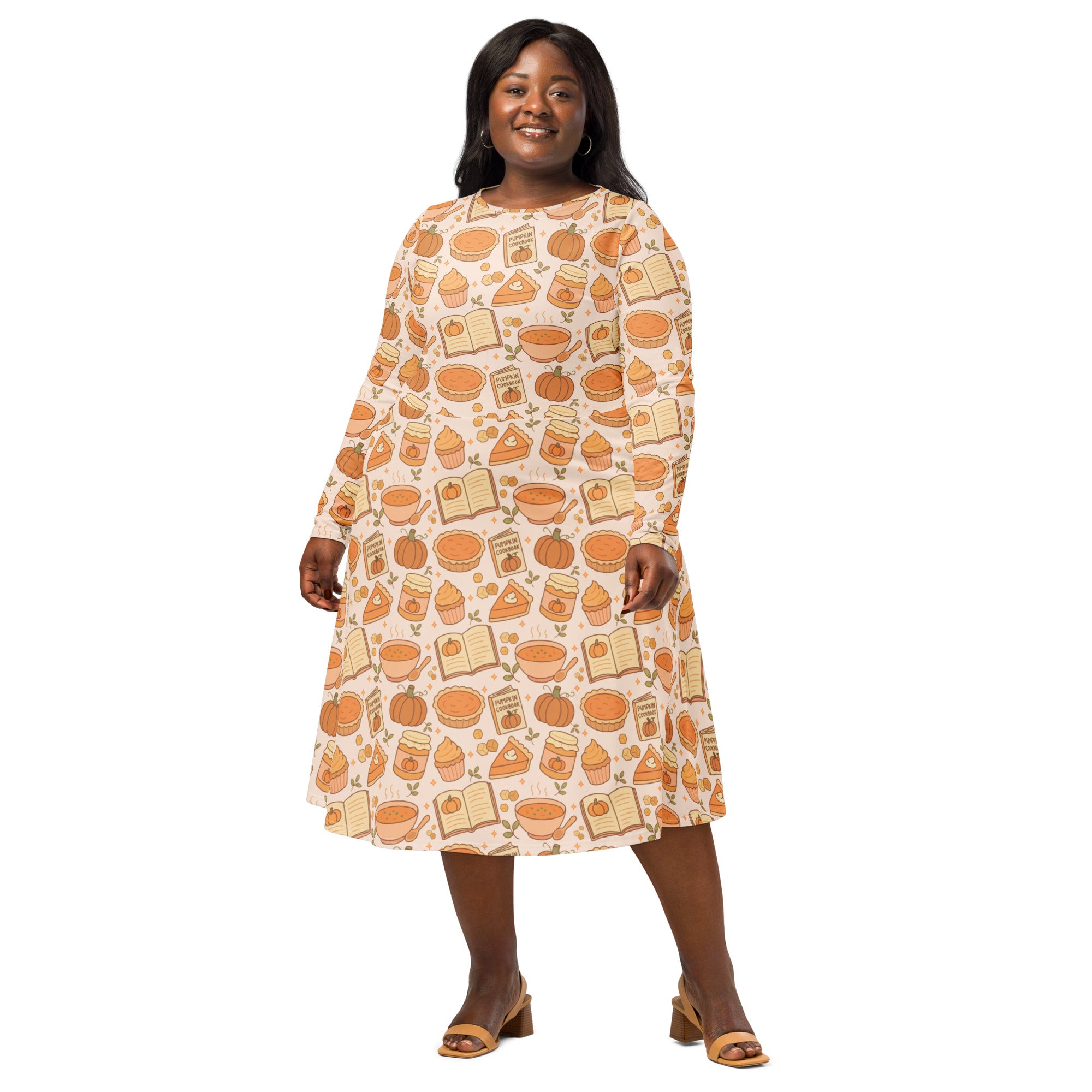 Women’s plus-size long sleeve midi dress in soft cream with pumpkin pie themed pattern and pockets