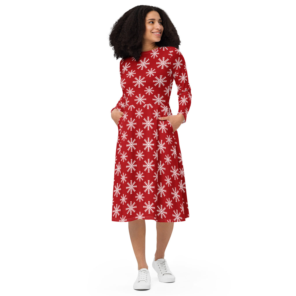Women’s red long sleeve midi dress with white snowflake pattern and side pockets for festive winter wear