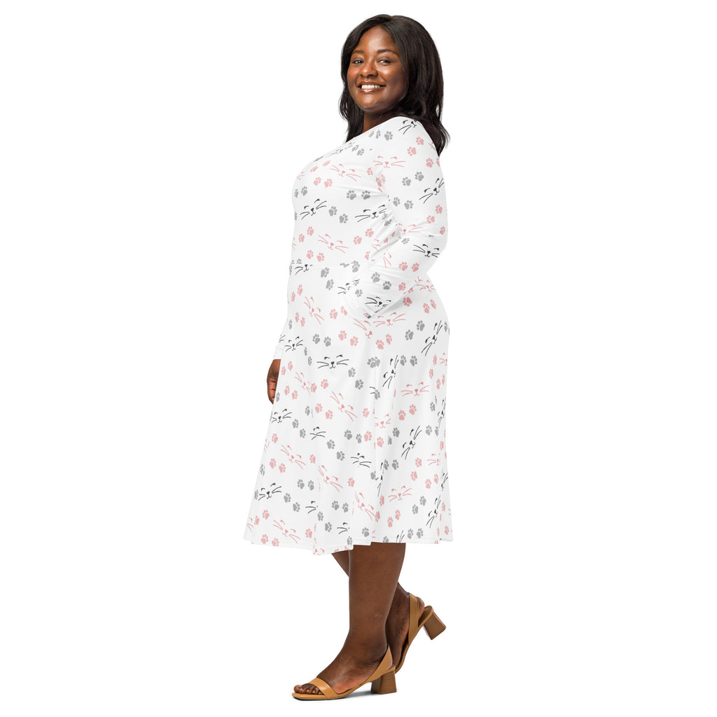 Women’s white long sleeve midi dress with pockets featuring a playful black gray and pink cat face pattern