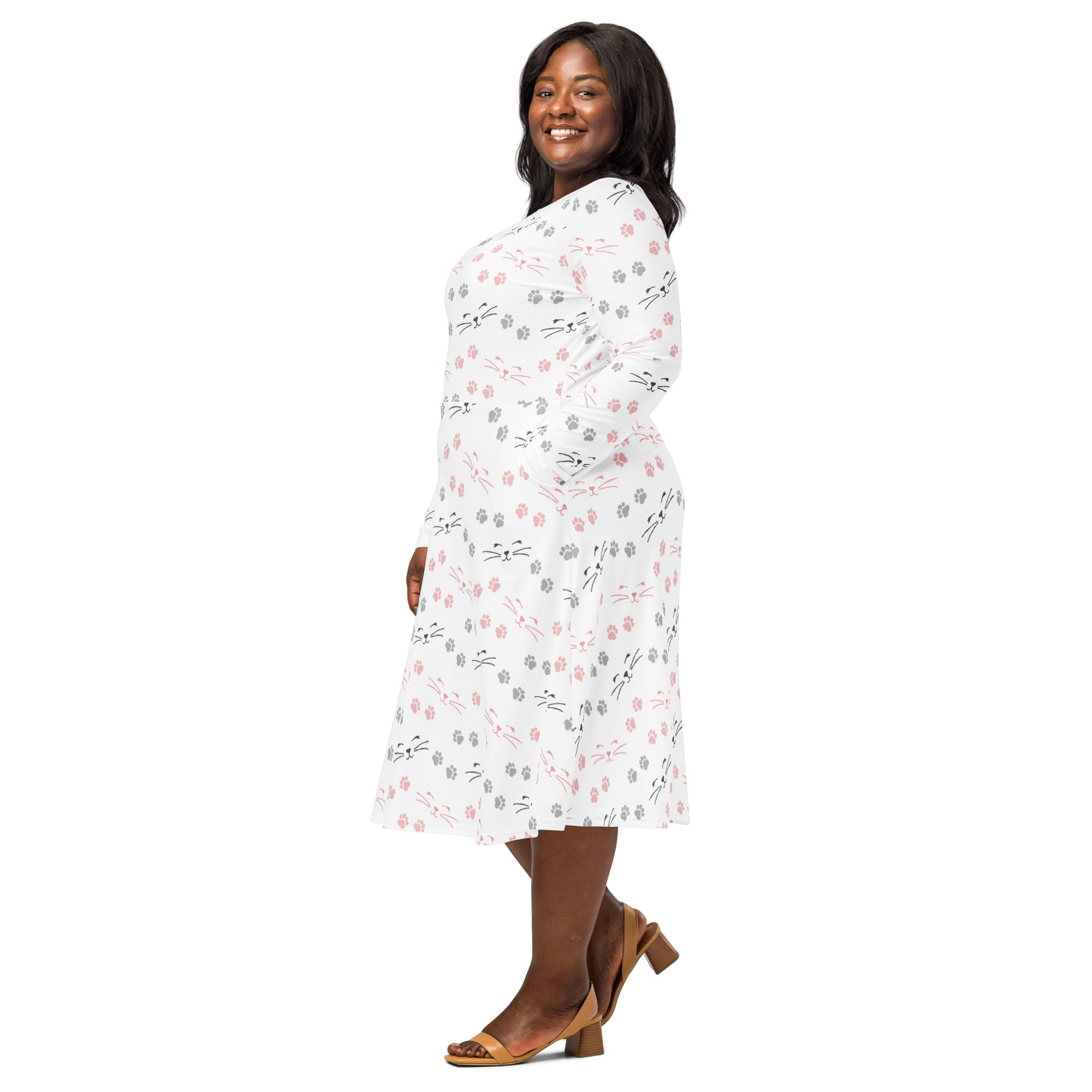 Women’s white long sleeve midi dress with pockets featuring a playful black gray and pink cat face pattern