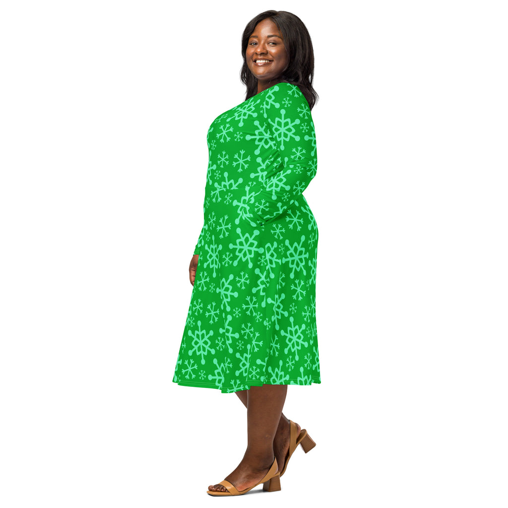 Women’s green long sleeve midi dress with pockets featuring a light mint snowflake pattern on vibrant fabric
