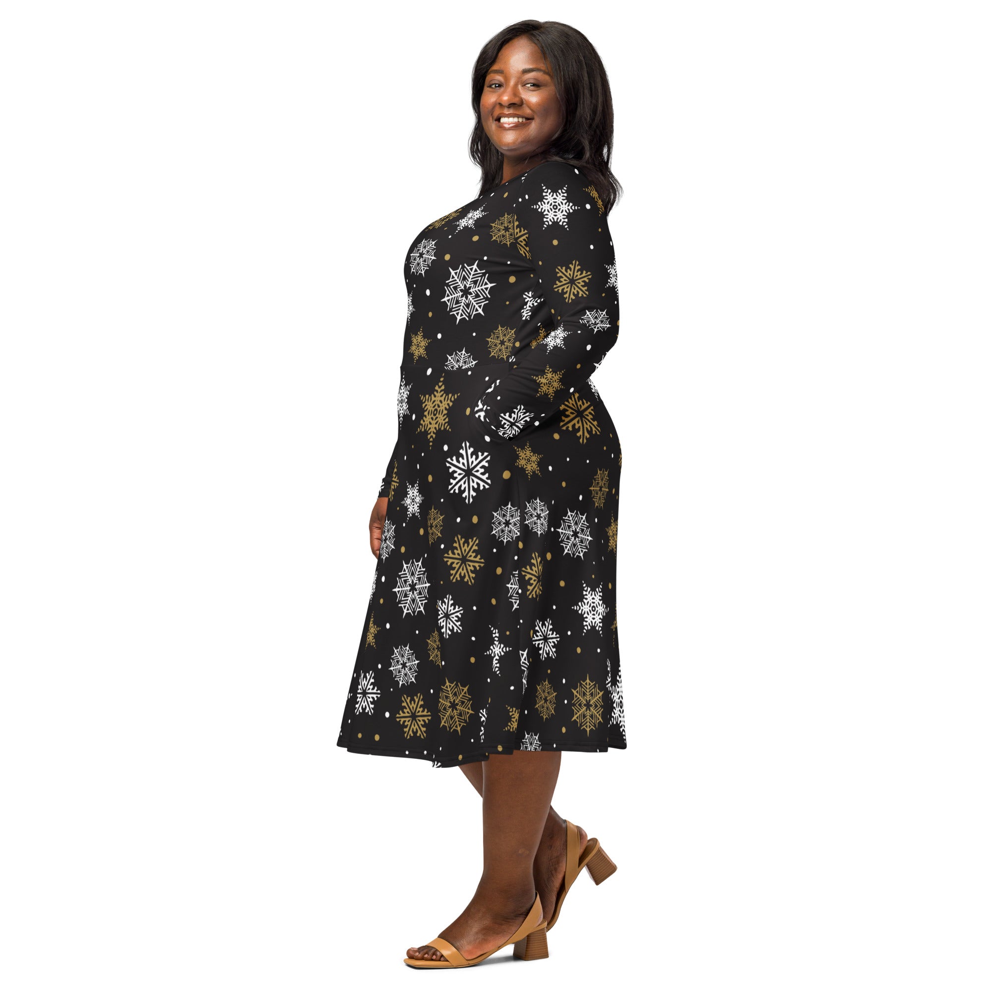 Women’s gold snowflake long sleeve black midi dress with white and gold snowflake patterns and pockets
