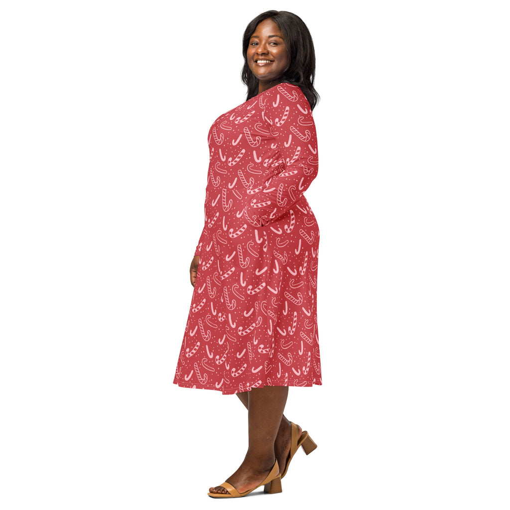 Women’s festive red long sleeve midi dress with candy cane pattern and pockets perfect for christmas events