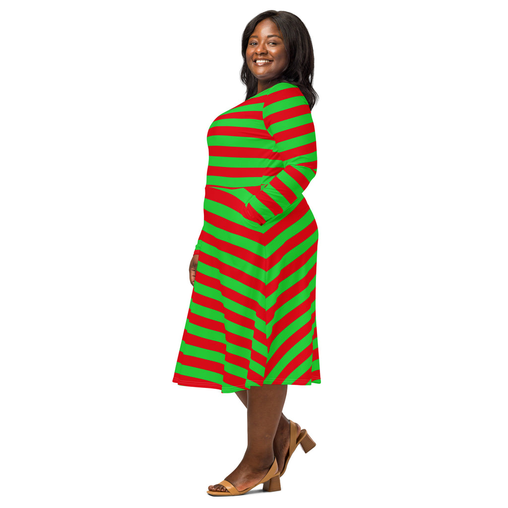 A plus-size woman wearing a red and green striped long sleeve midi dress with pockets and vibrant colors