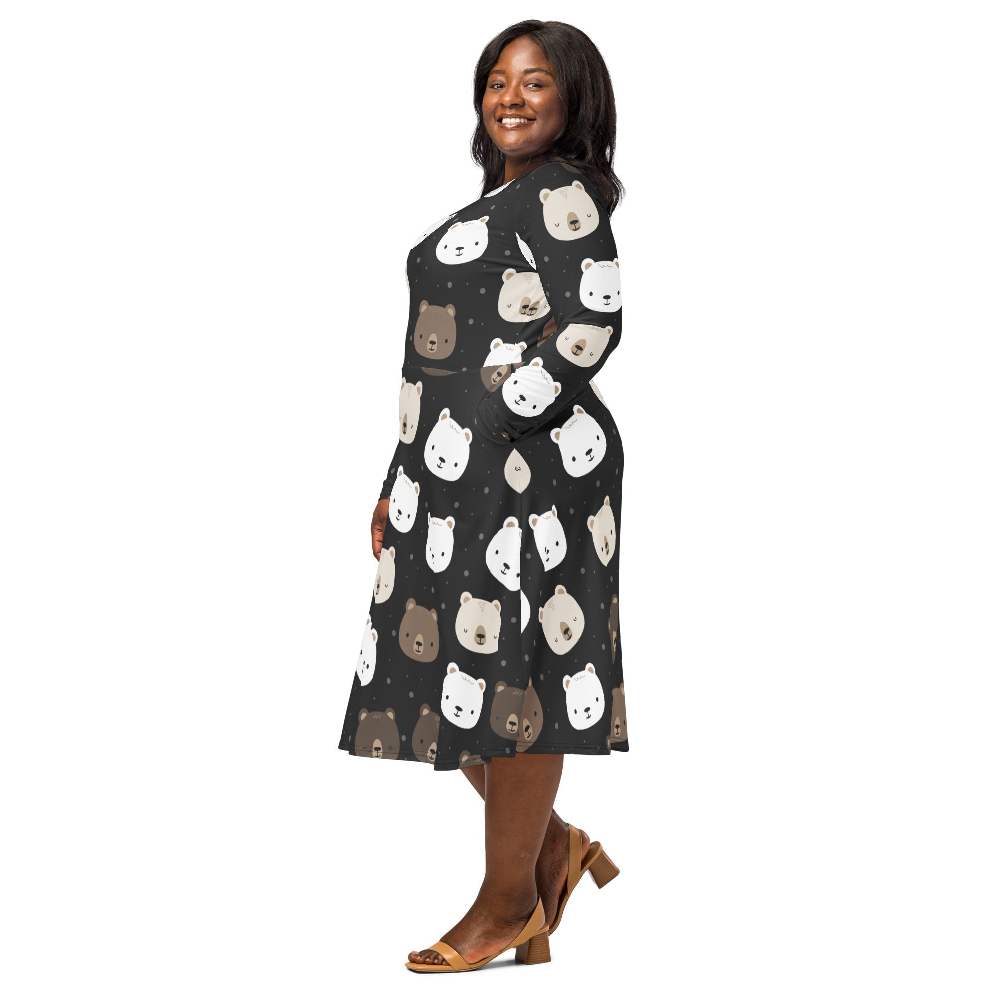 Women’s black midi dress with long sleeves and pockets featuring a playful white and brown bear face pattern on dark fabric