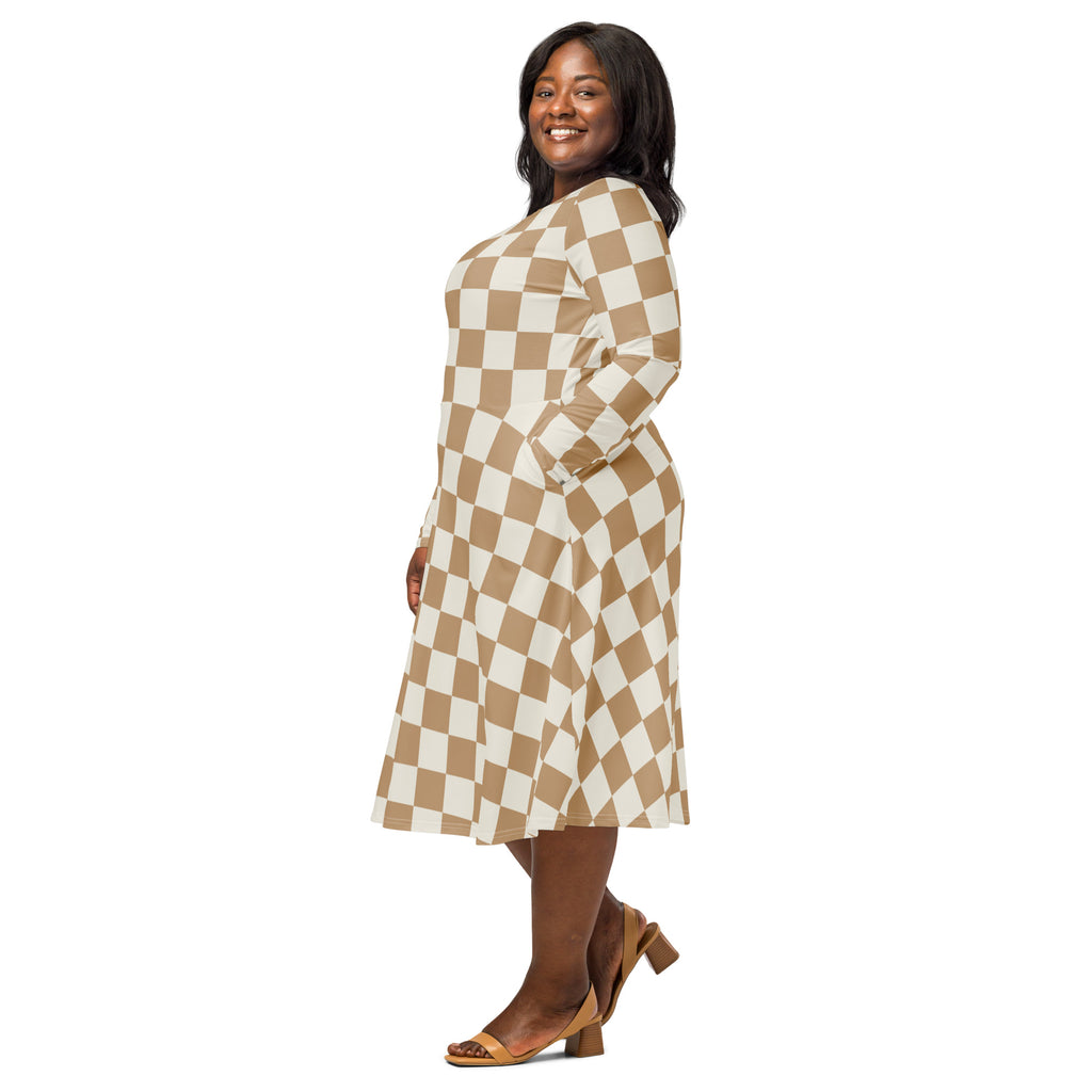 A plus-size woman wearing a tan checkerboard long sleeve midi dress with pockets in beige and white plaid