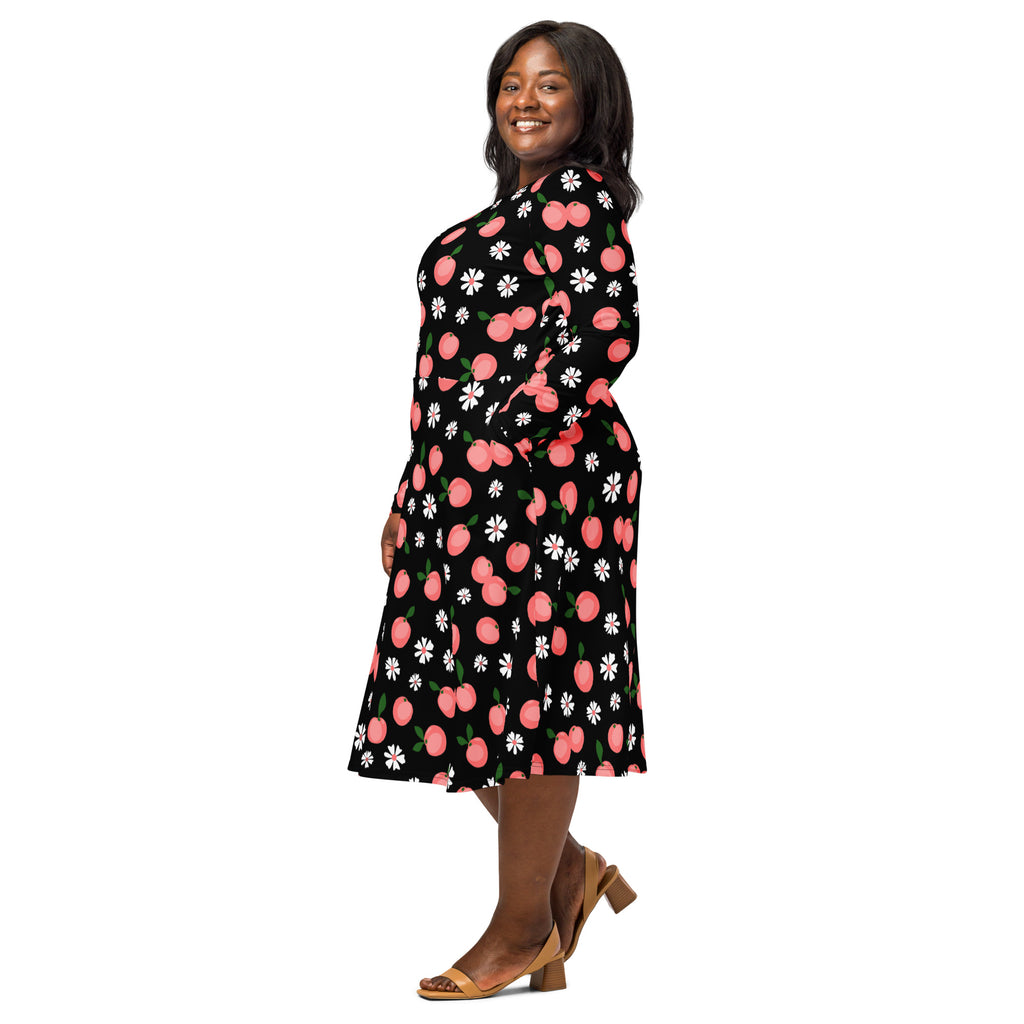 Women’s black wrap midi dress with long sleeves featuring a playful peach and daisy pattern and pockets