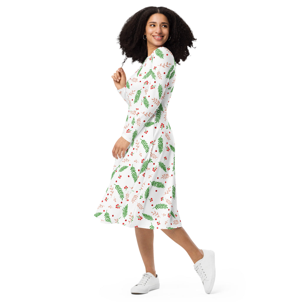 White midi dress with long sleeves and pockets featuring green fern and red berry holly pattern for christmas wear
