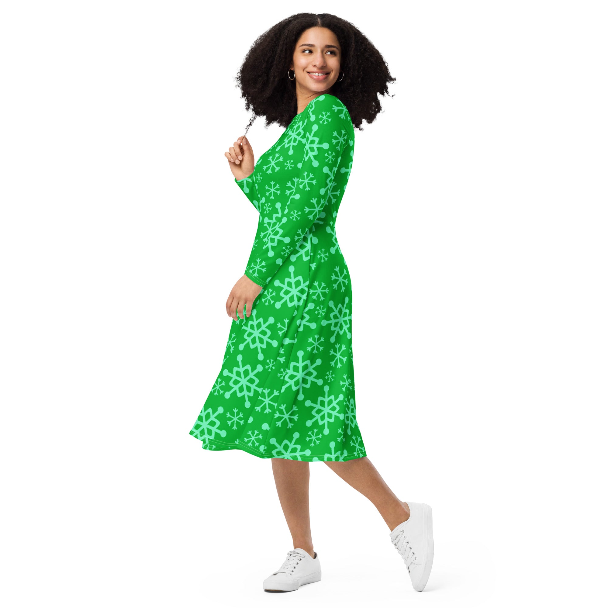 Women’s green snowflake long sleeve midi dress with pockets featuring light mint snowflake pattern on sleeves and skirt