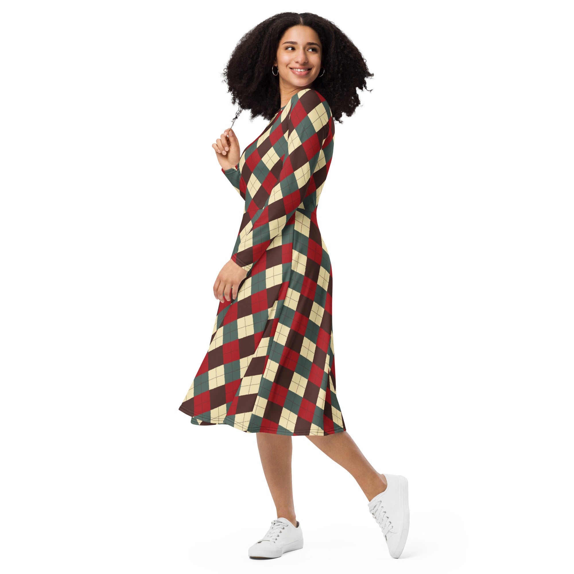 A woman wearing a women’s Christmas argyle long sleeve midi dress with red green and cream pattern and pockets