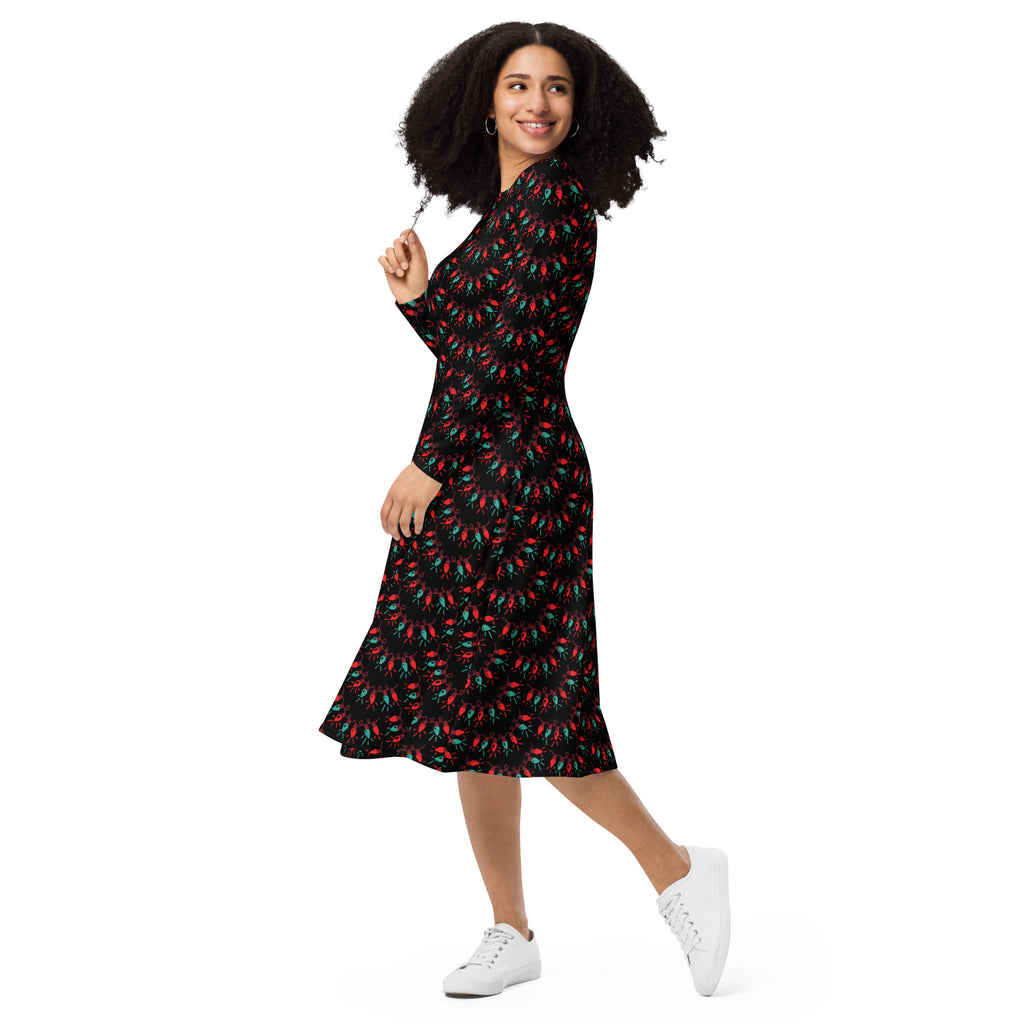 Women’s black long sleeve midi dress with pockets featuring a vibrant red and green chili pepper pattern