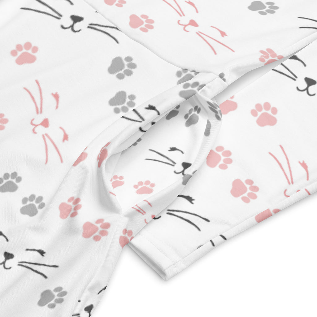White fabric long sleeve midi dress with pink paw prints and black cat faces featuring pockets for women