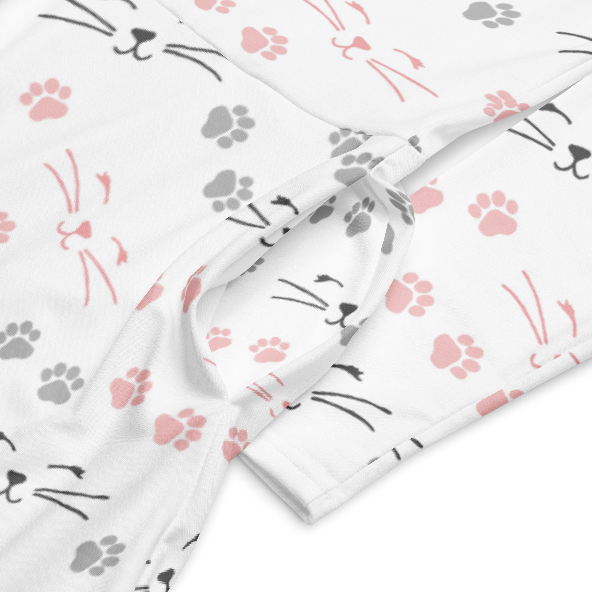 White fabric long sleeve midi dress with pink paw prints and black cat faces featuring pockets for women