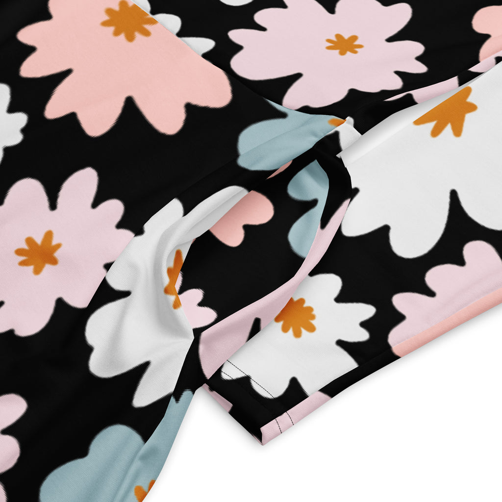 Women’s retro floral long sleeve midi dress with pockets in black fabric with pink white light blue blossoms and orange centers
