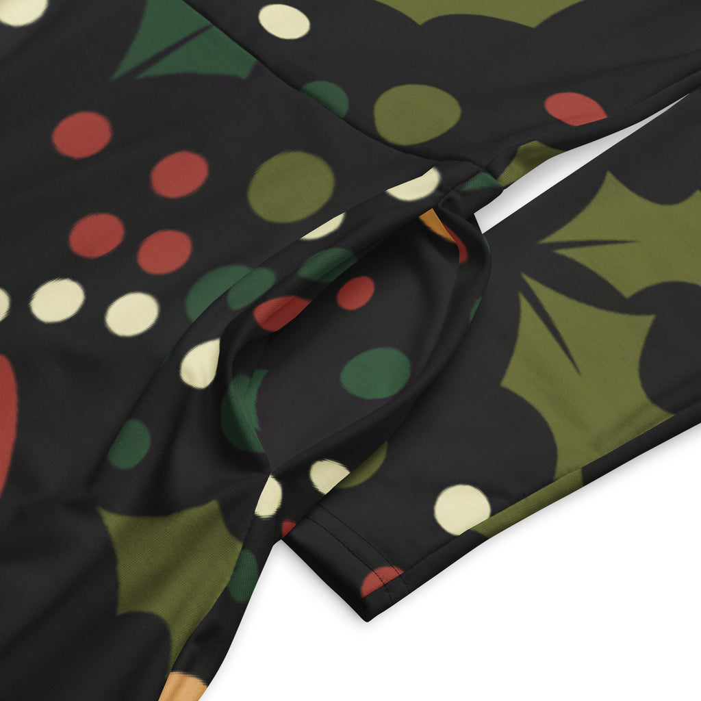 Women’s dark holly berry long sleeve midi dress with pockets in black fabric featuring festive green holly leaves and red berries