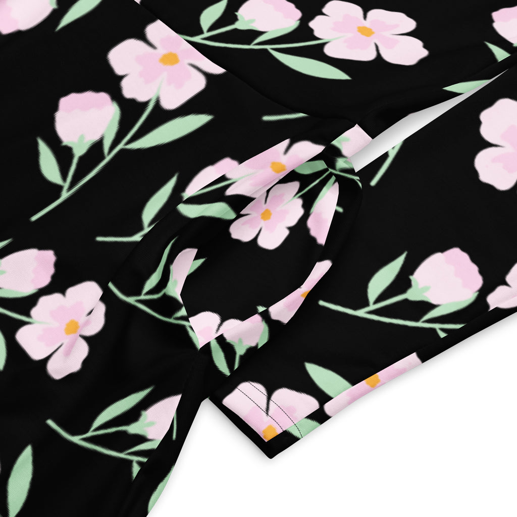 Women’s black floral long sleeve midi dress with pockets featuring pink flowers and light green leaves pattern