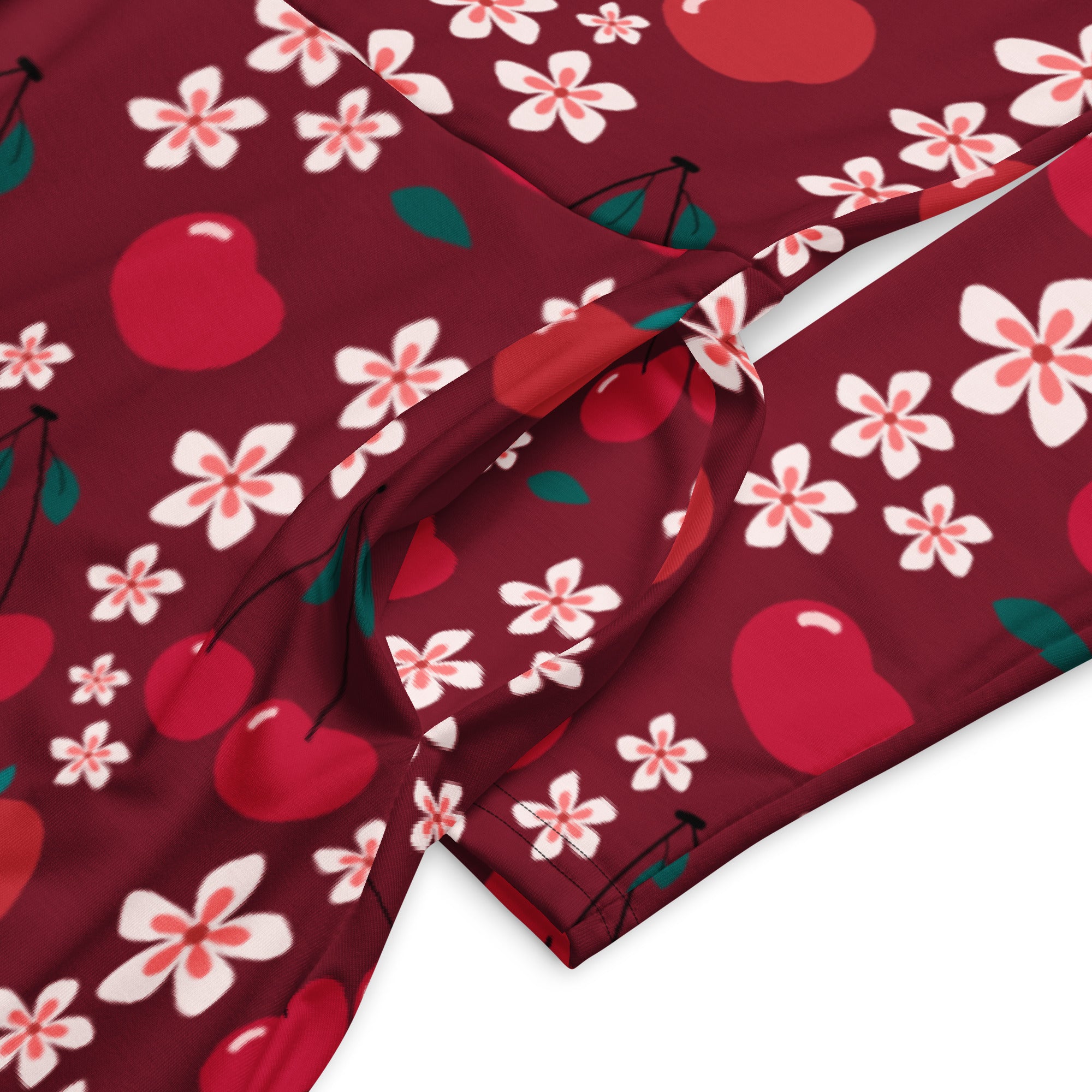 Women’s maroon cherry blossom long sleeve midi dress with pockets featuring red cherries white blossoms and green leaves pattern