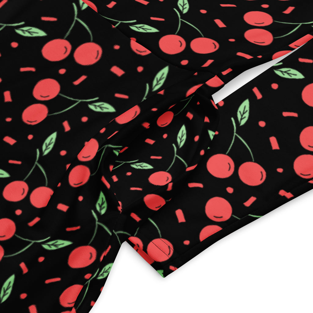 Women’s vintage cherry long sleeve midi dress with pockets in black fabric featuring red cherries green leaves and pink confetti