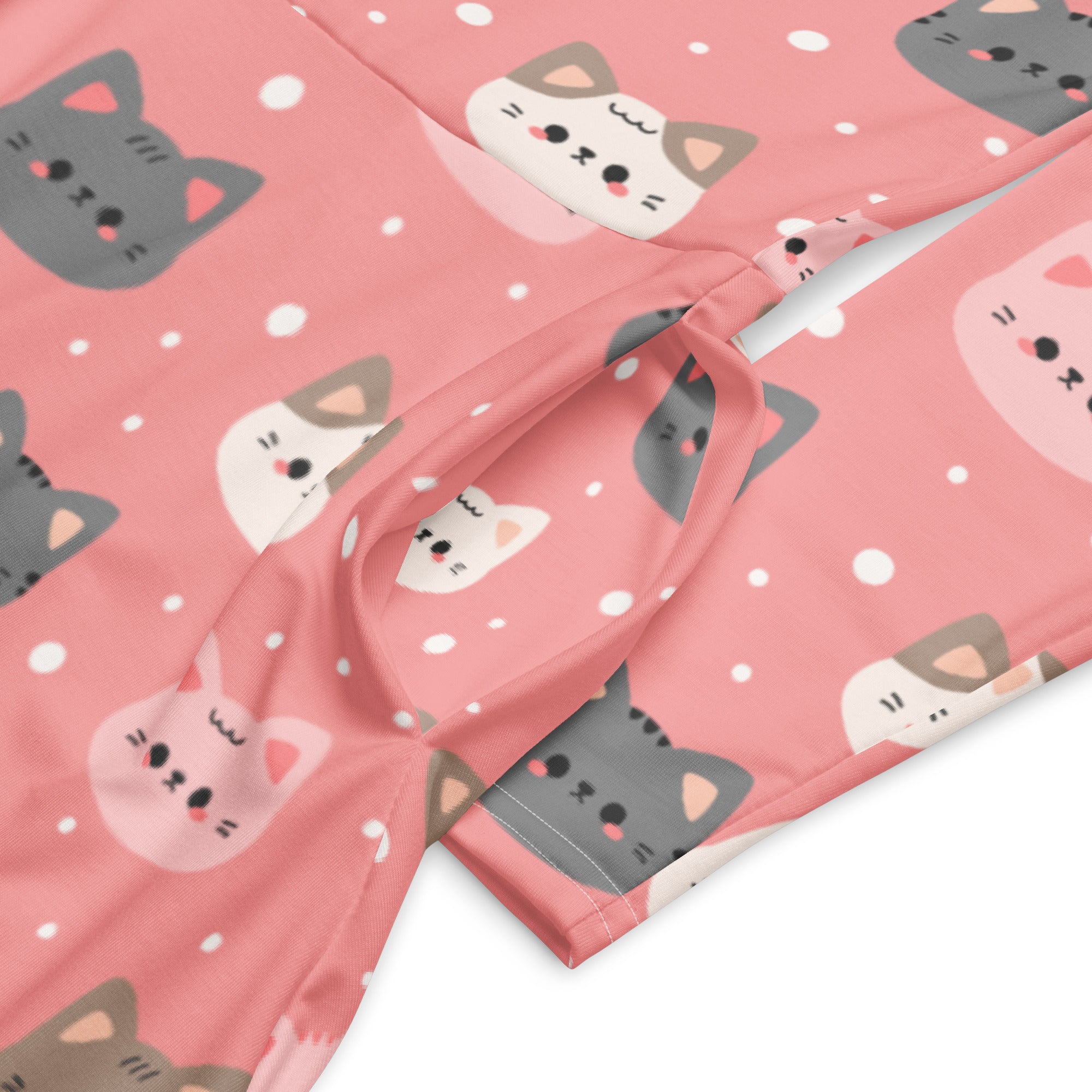 Women’s long sleeve midi dress in soft pink with playful gray white and brown cartoon cat faces and pockets