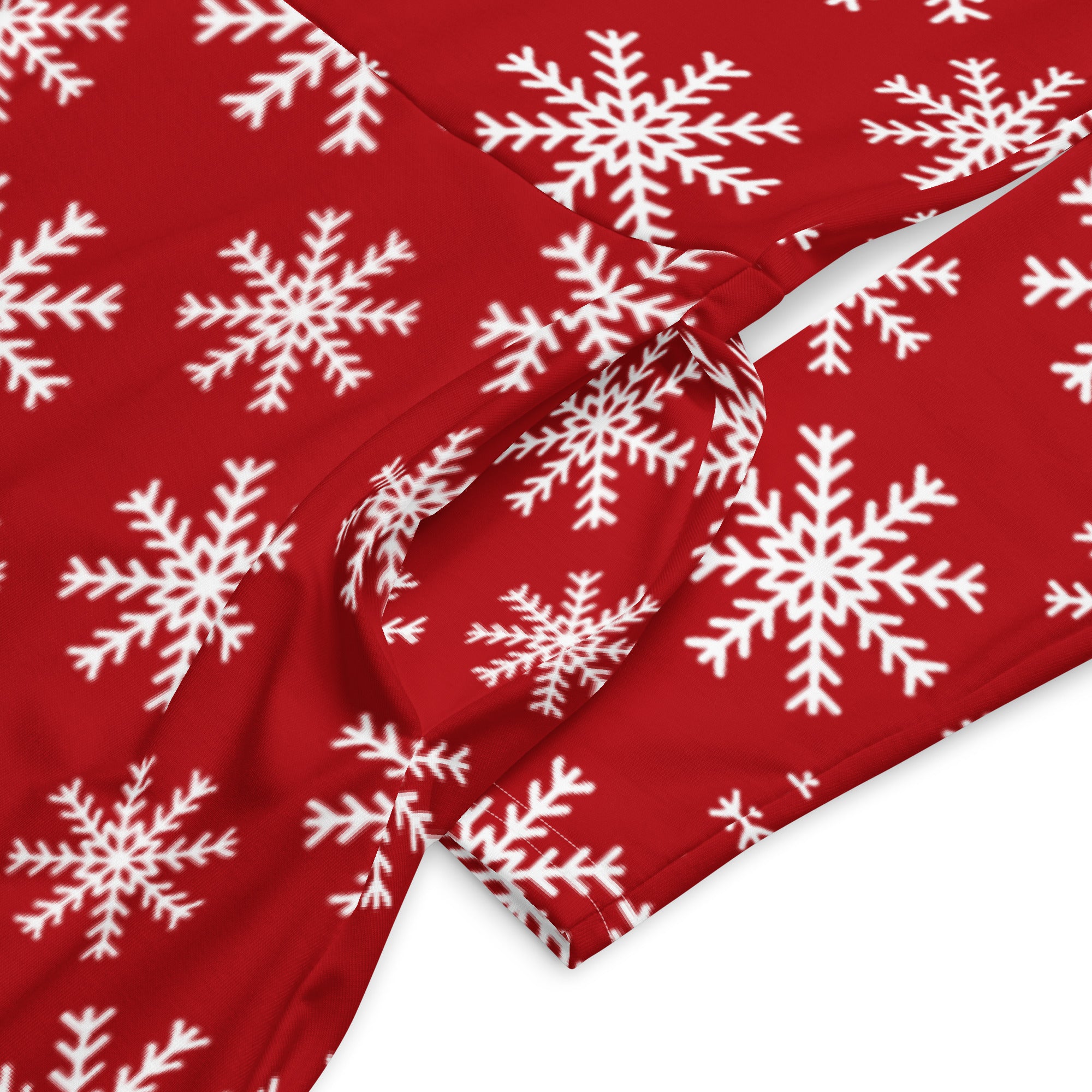 Women’s red long sleeve midi dress with white snowflake pattern and pockets for festive winter wear