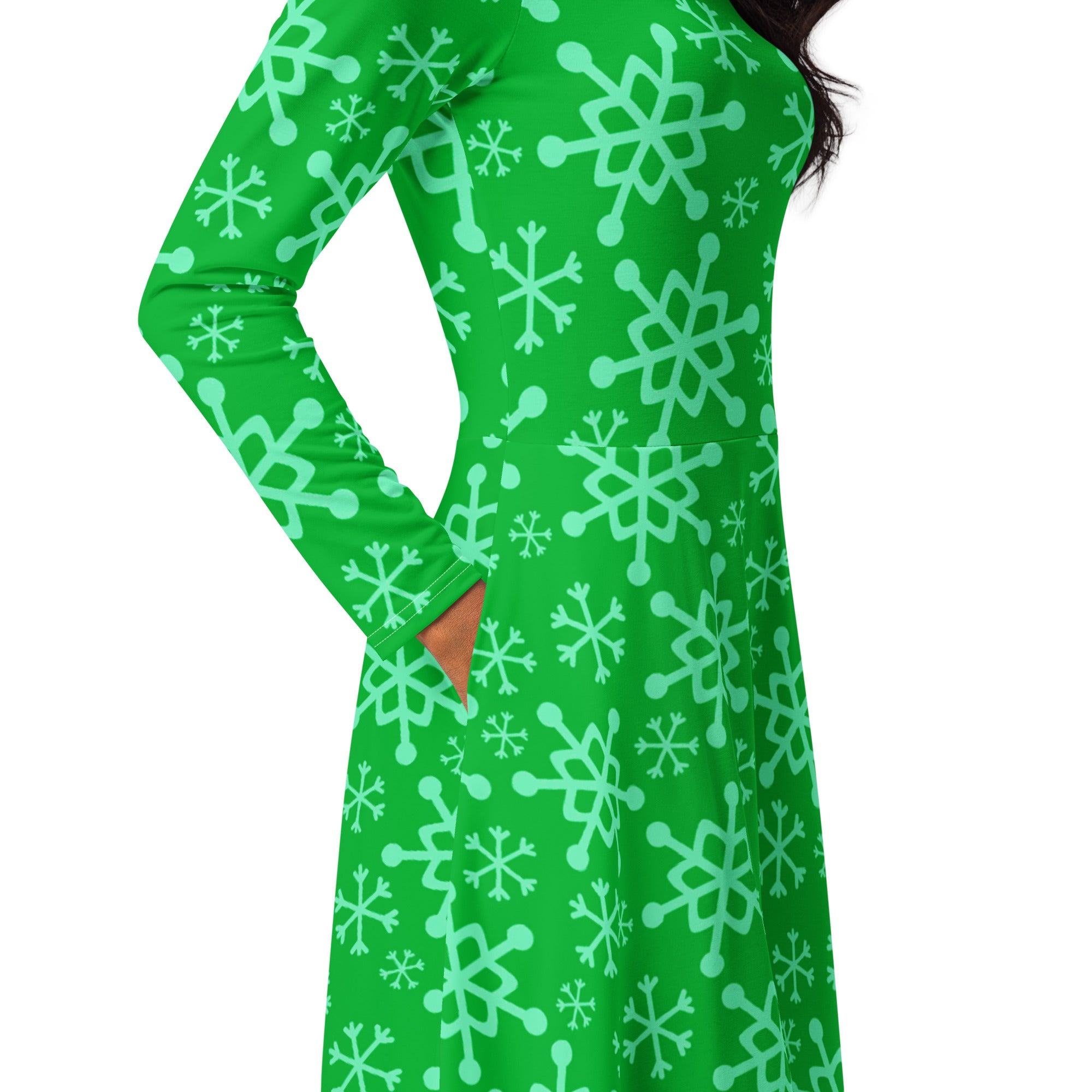 Women’s vibrant green long-sleeved midi dress with playful light mint snowflake pattern and pockets
