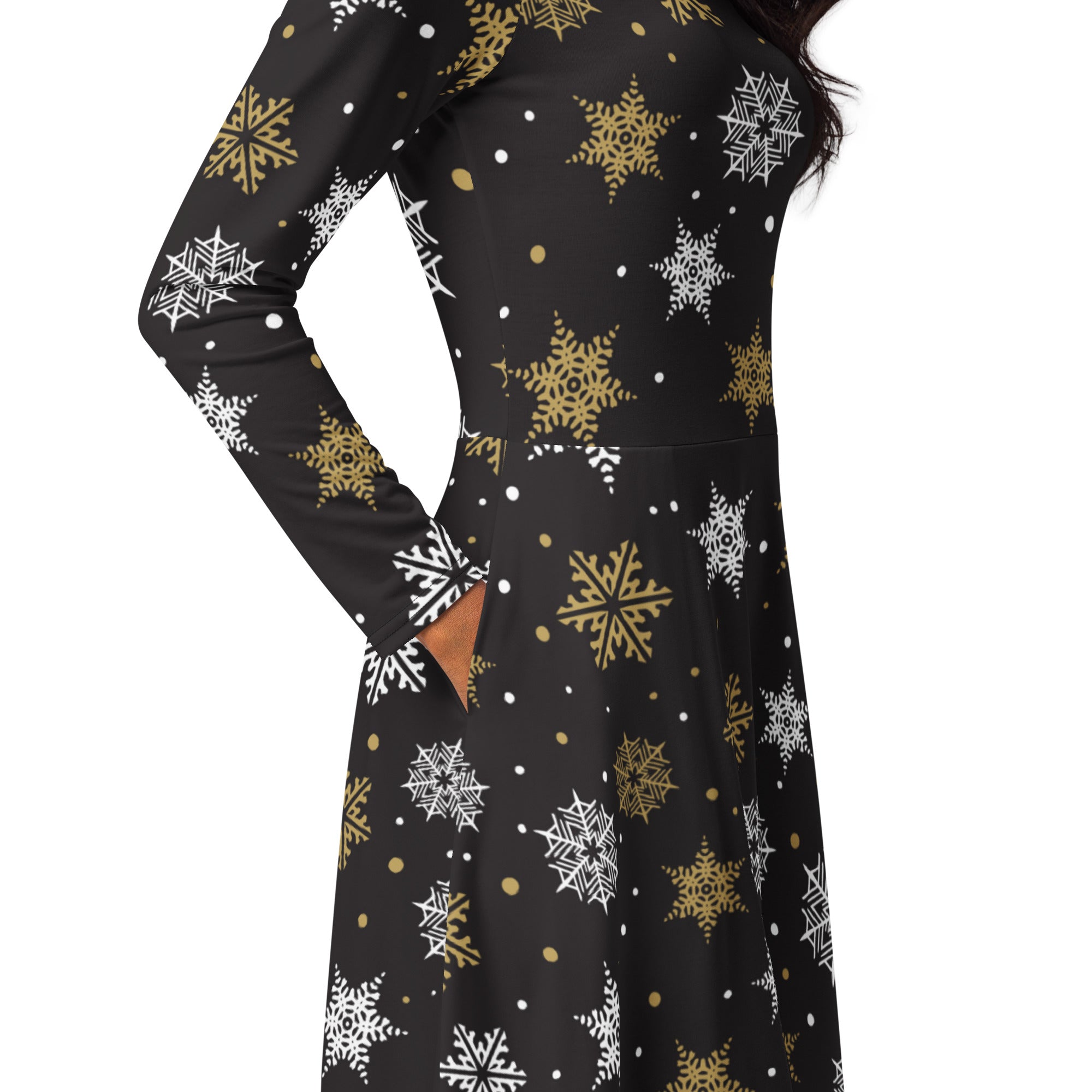 Women’s black long-sleeved midi dress with white and gold snowflake patterns and pockets for winter wear
