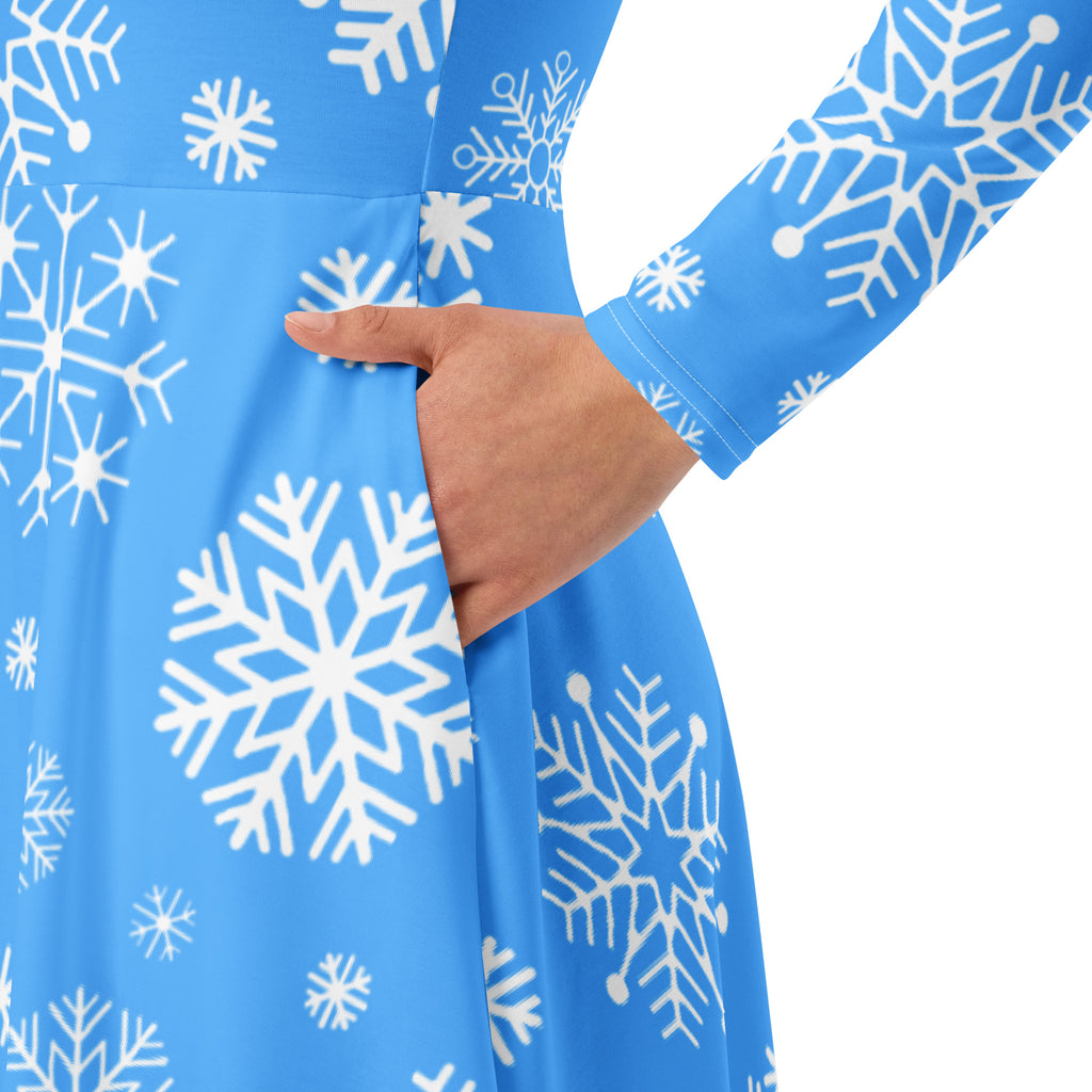 Women’s blue snowflake long sleeve midi dress with pockets featuring a fitted bodice and playful white snowflake pattern