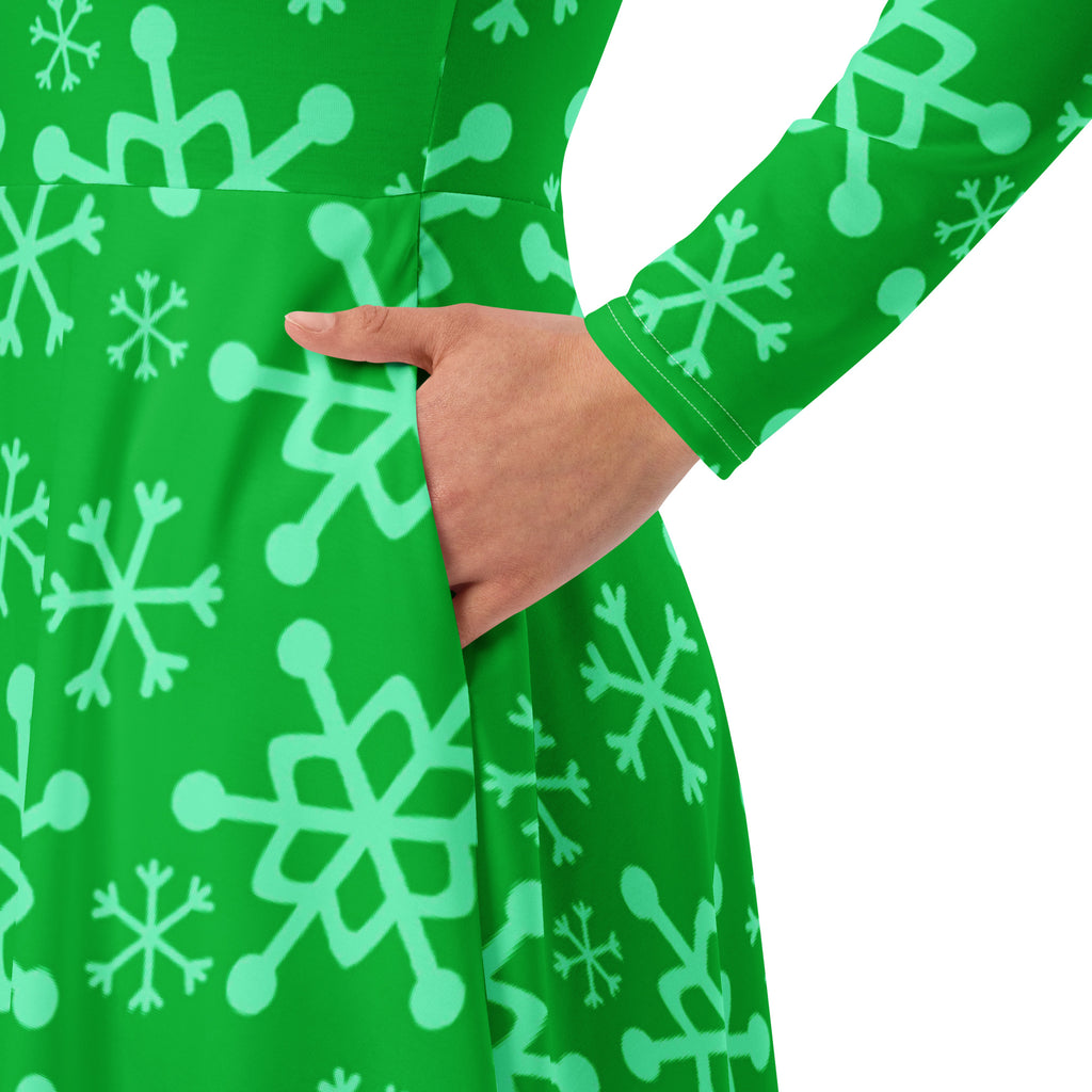 Women’s green long sleeve midi dress with pockets featuring a playful light mint snowflake and molecular pattern