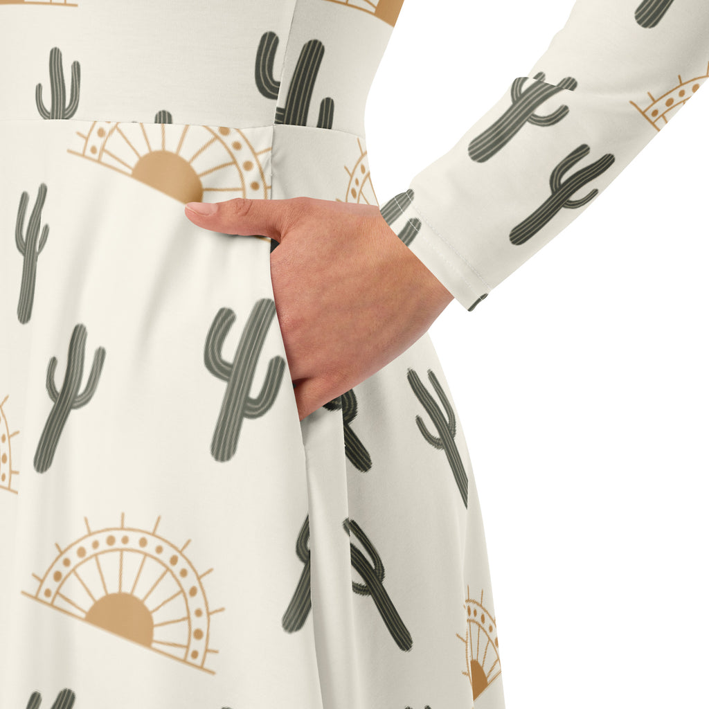 White long sleeve midi dress with pockets featuring gray cactus and tan sunburst pattern for women