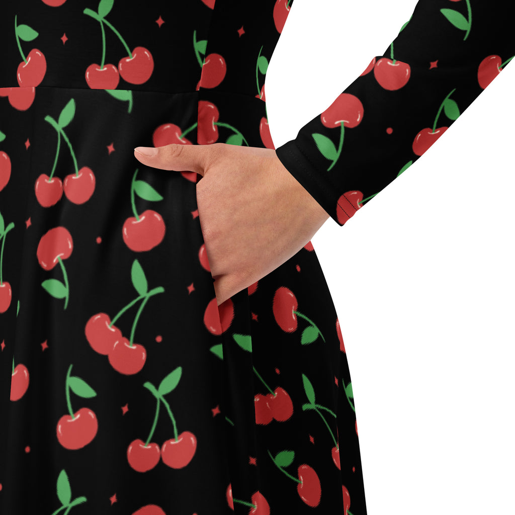 Women’s black cherry long sleeve midi dress with playful red and green pattern and pockets