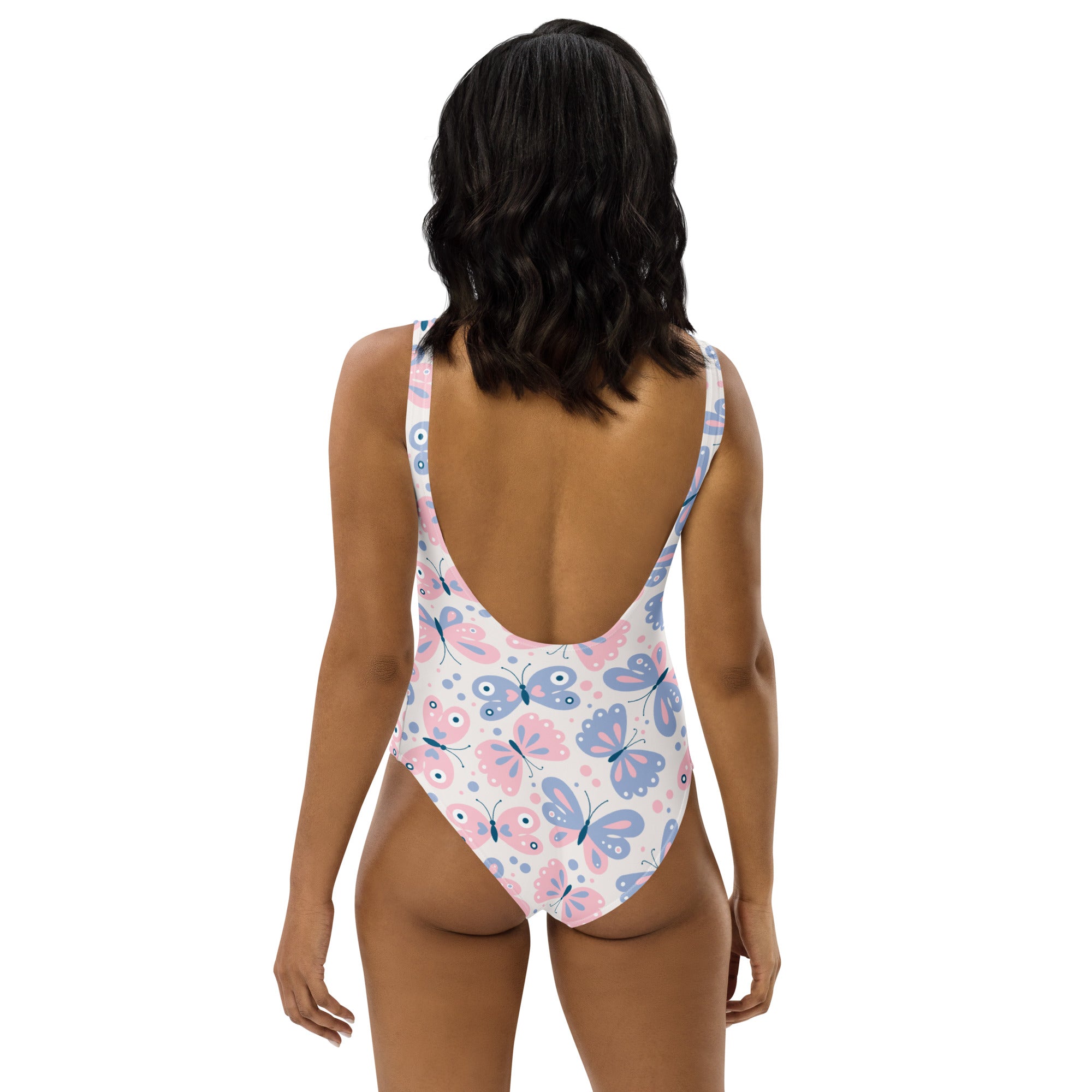 One-piece swimsuit with pink and blue butterfly pattern on white, thin straps, open back, buttery soft with UPF 50+ protection
