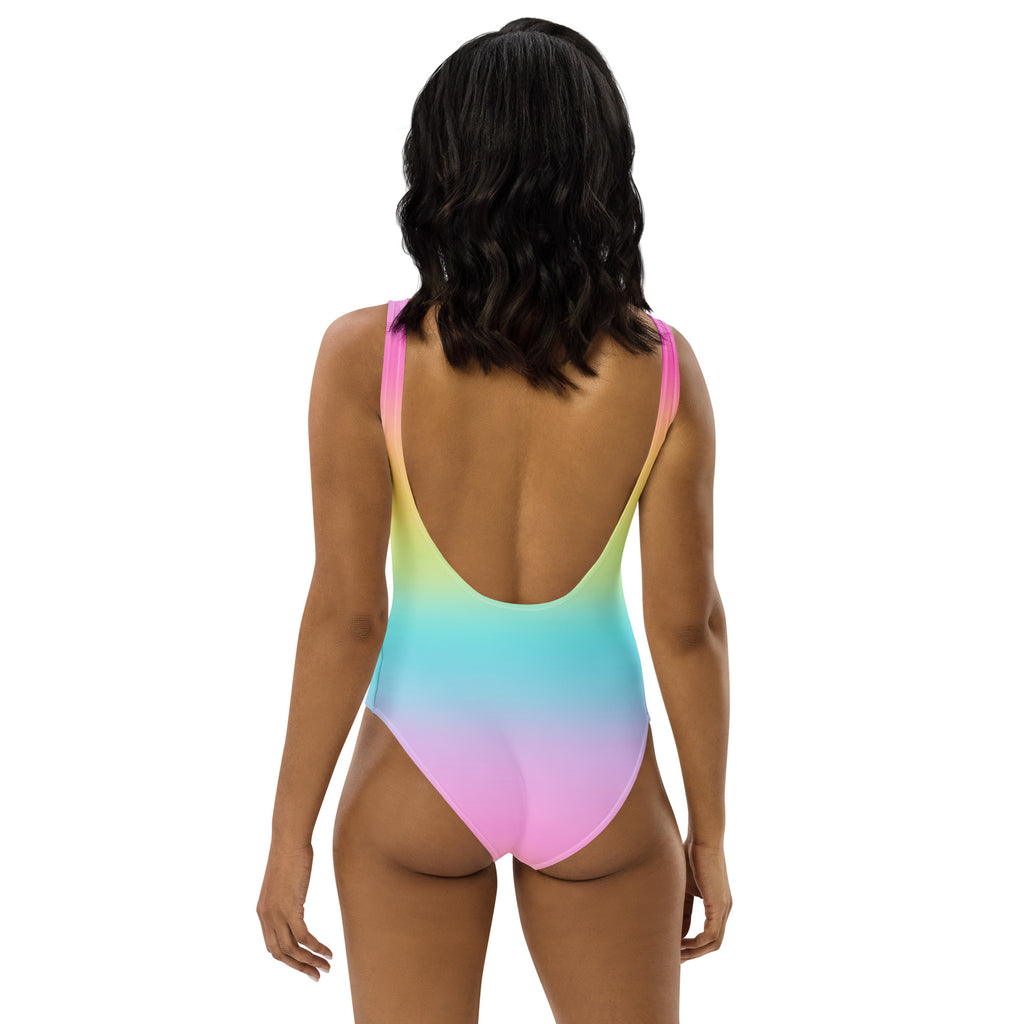 Women’s bright rainbow buttery soft one-piece swimsuit with thin straps low back and upf 50 plus protection shown from back