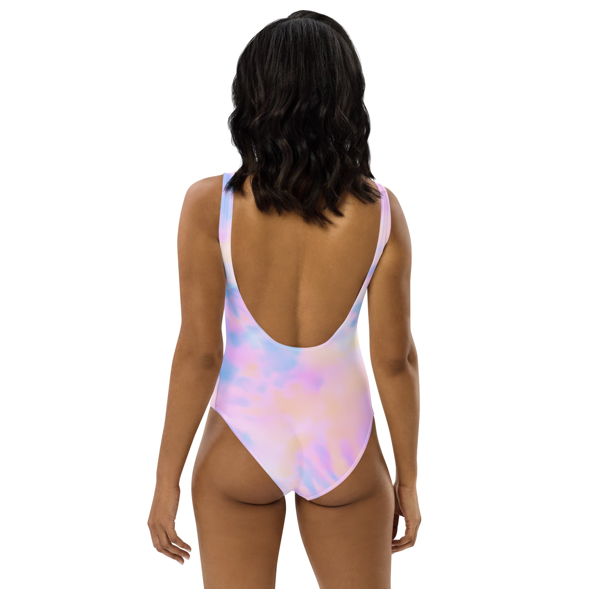 A vibrant iridescent pastel watercolor one-piece swimsuit with deep back cutout thin straps and UPF 50 plus protection