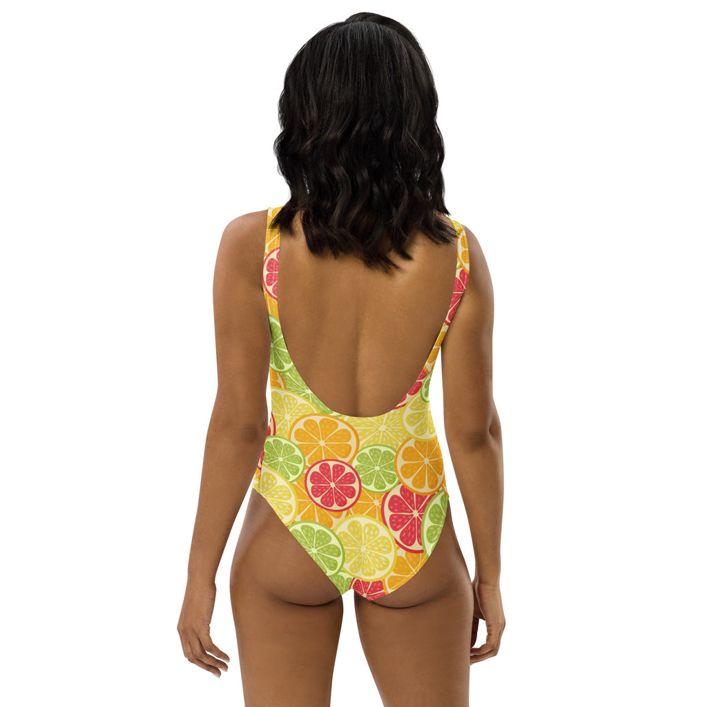 A vibrant yellow women’s one-piece citrus fruit slices swimsuit with buttery soft fabric and UPF 50 plus protection