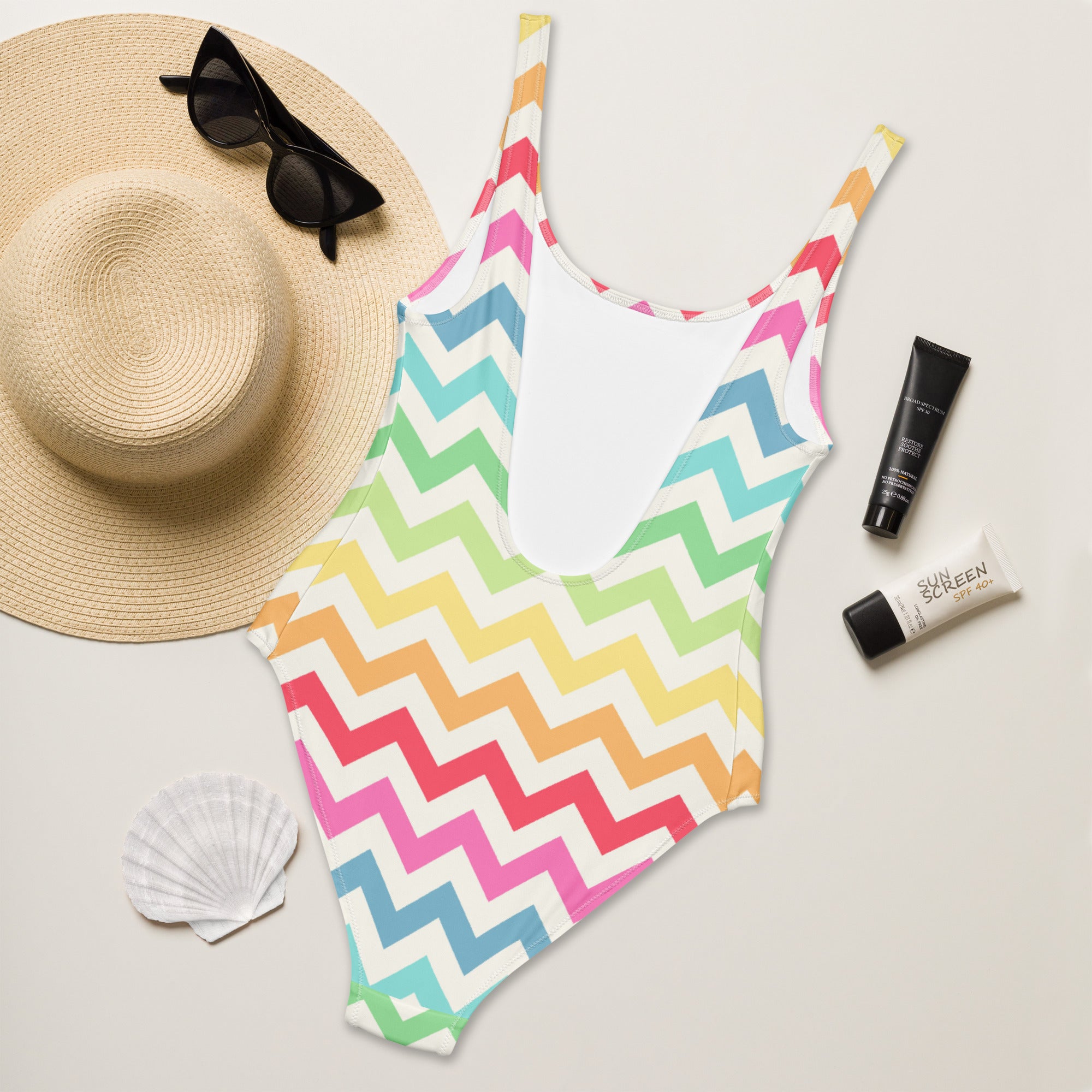 Women’s pastel rainbow chevron buttery soft one-piece swimsuit with upf 50 plus thin straps and white interior