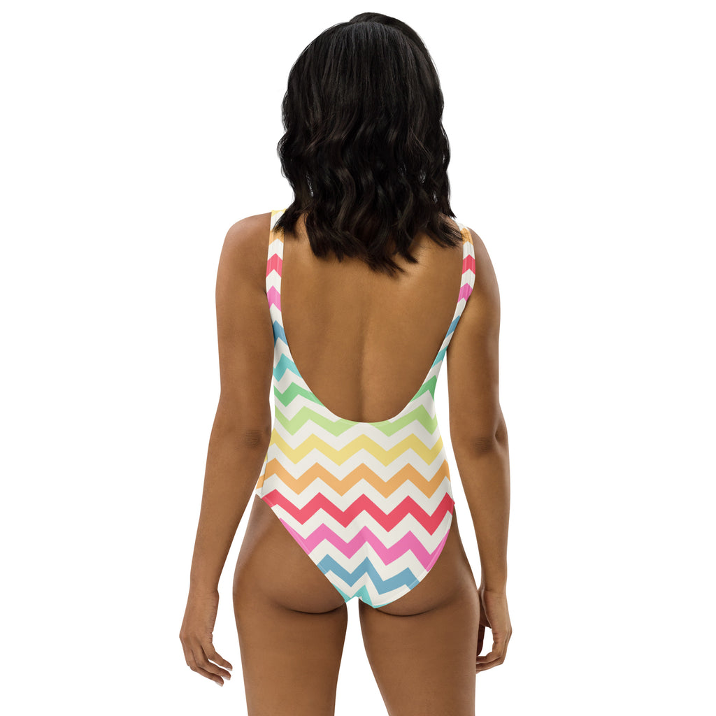 A vibrant pastel rainbow chevron buttery soft one-piece swimsuit with thin straps backless design and UPF 50+ protection
