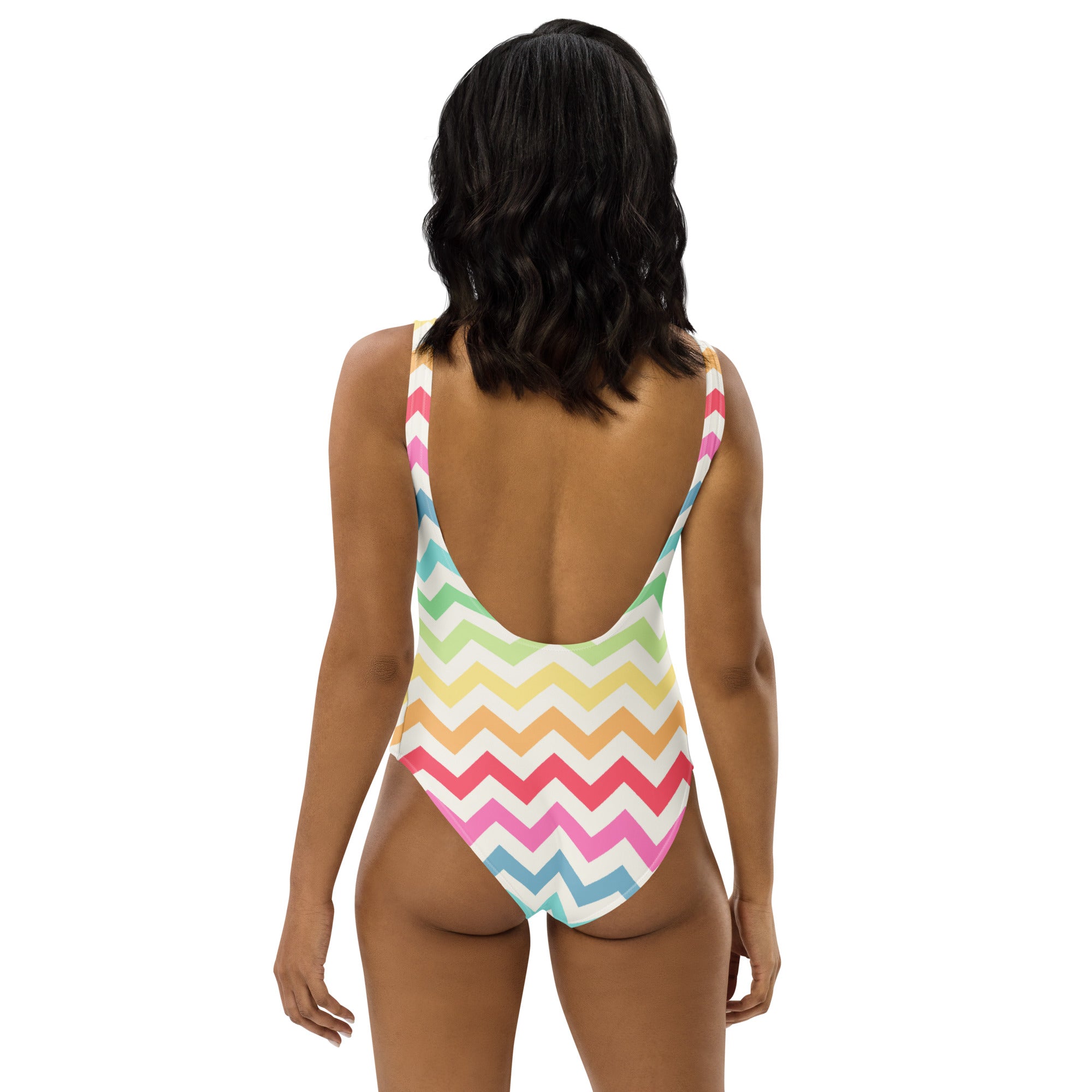 A vibrant pastel rainbow chevron buttery soft one-piece swimsuit with thin straps backless design and UPF 50+ protection