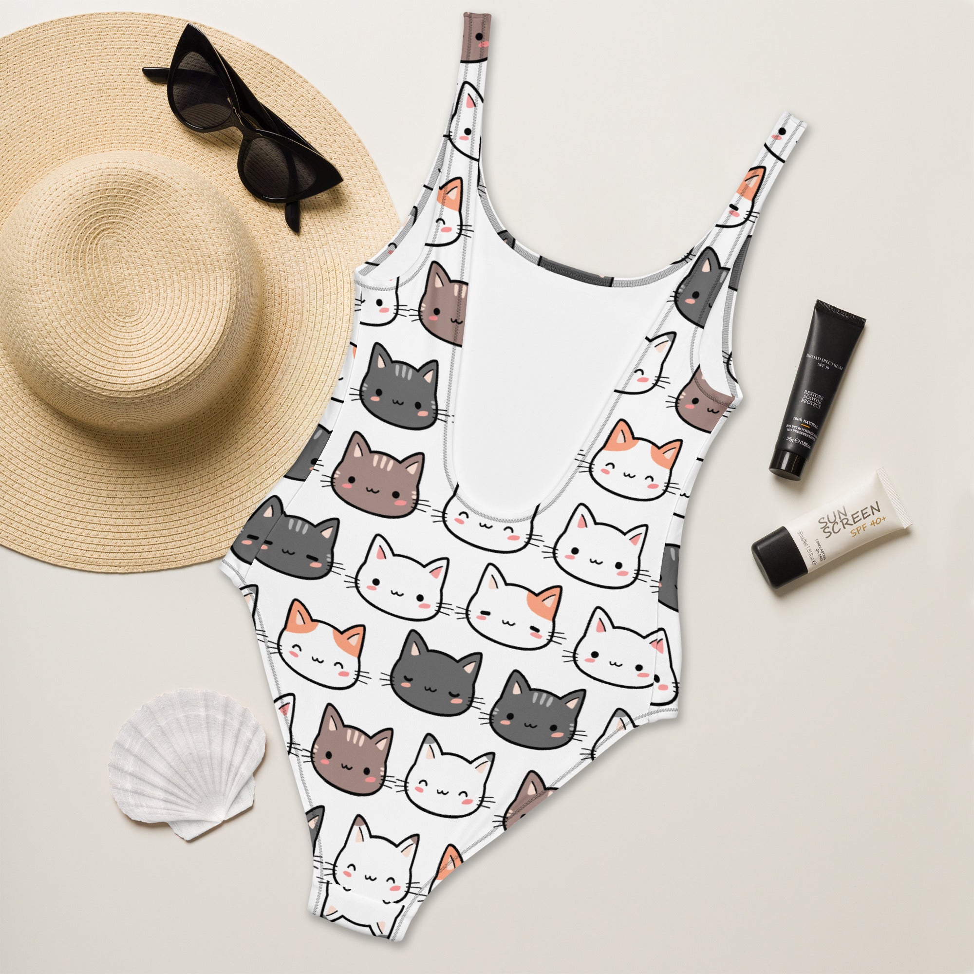 White one-piece buttery soft swimsuit with upf 50 plus featuring a colorful cartoon cat pattern for women