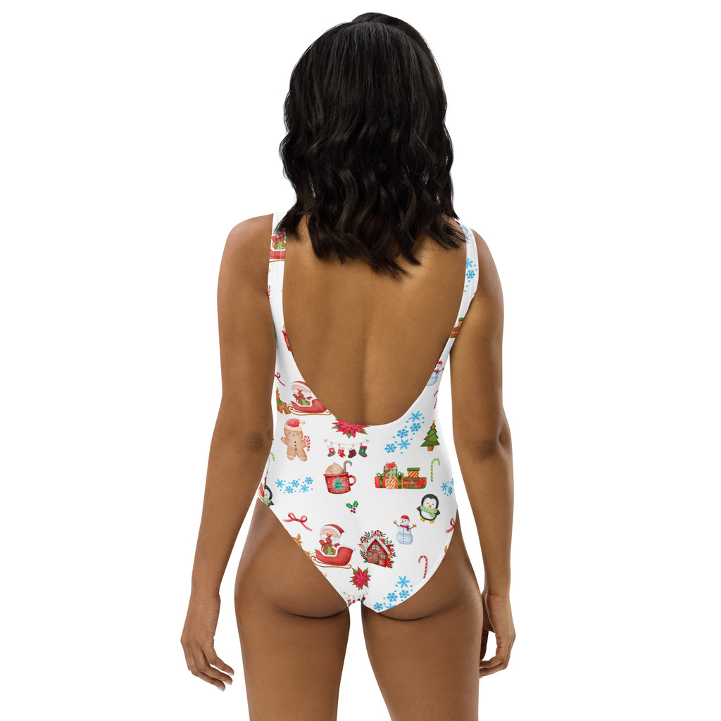 White one-piece buttery soft swimsuit with festive red green blue and brown Christmas print and UPF 50+ protection