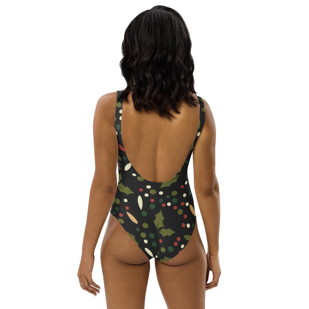 Women’s dark holly berry Christmas one-piece swimsuit with festive holly pattern and buttery soft fabric with UPF 50+
