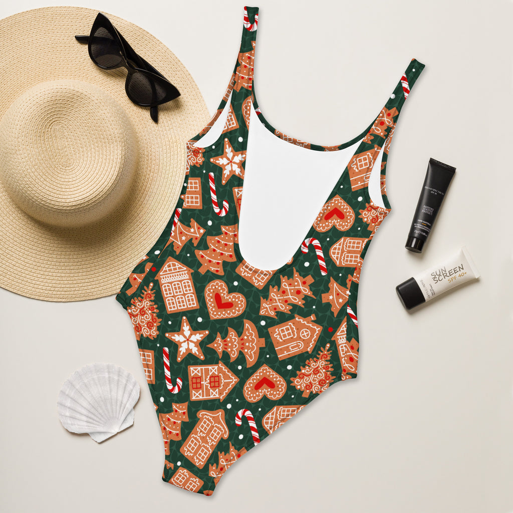 Women’s green gingerbread Christmas buttery soft one-piece swimsuit with candy cane and star pattern and UPF 50+ protection