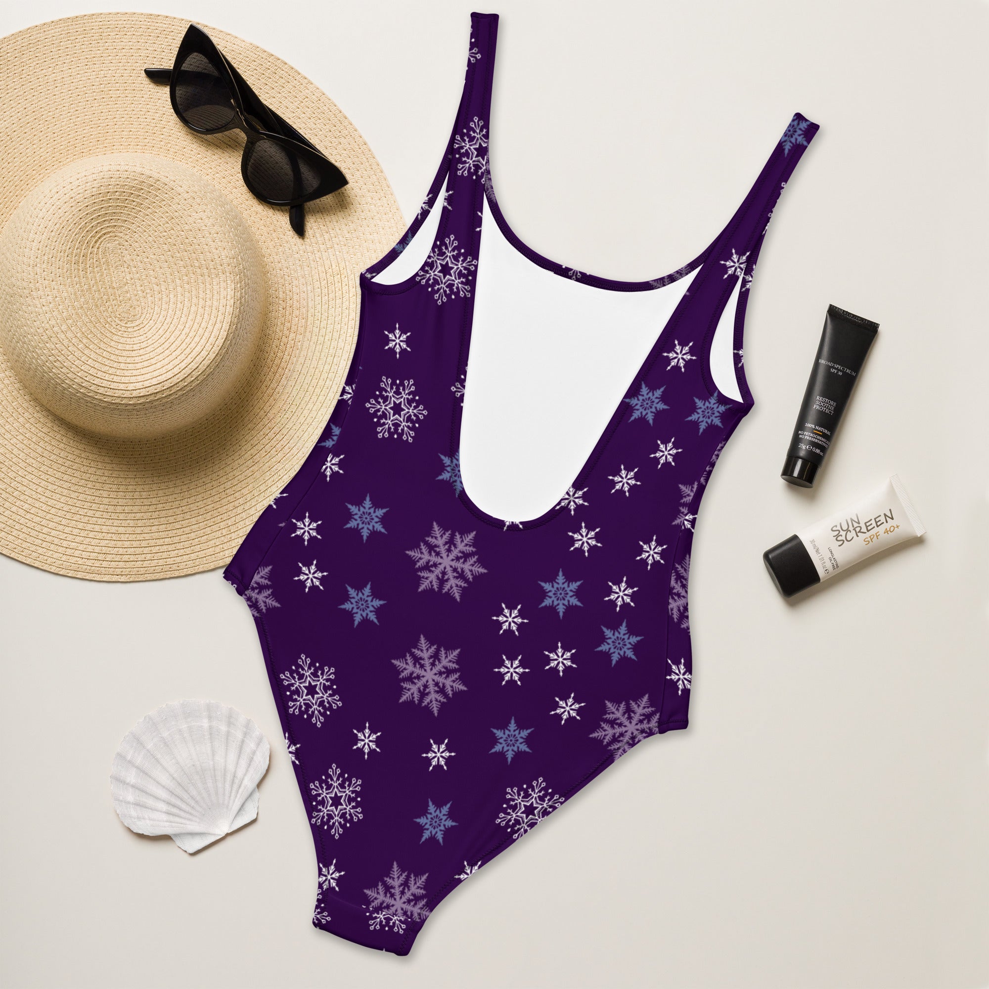 Women’s purple snowflake buttery soft one-piece swimsuit with thin straps backless design and upf 50+ protection