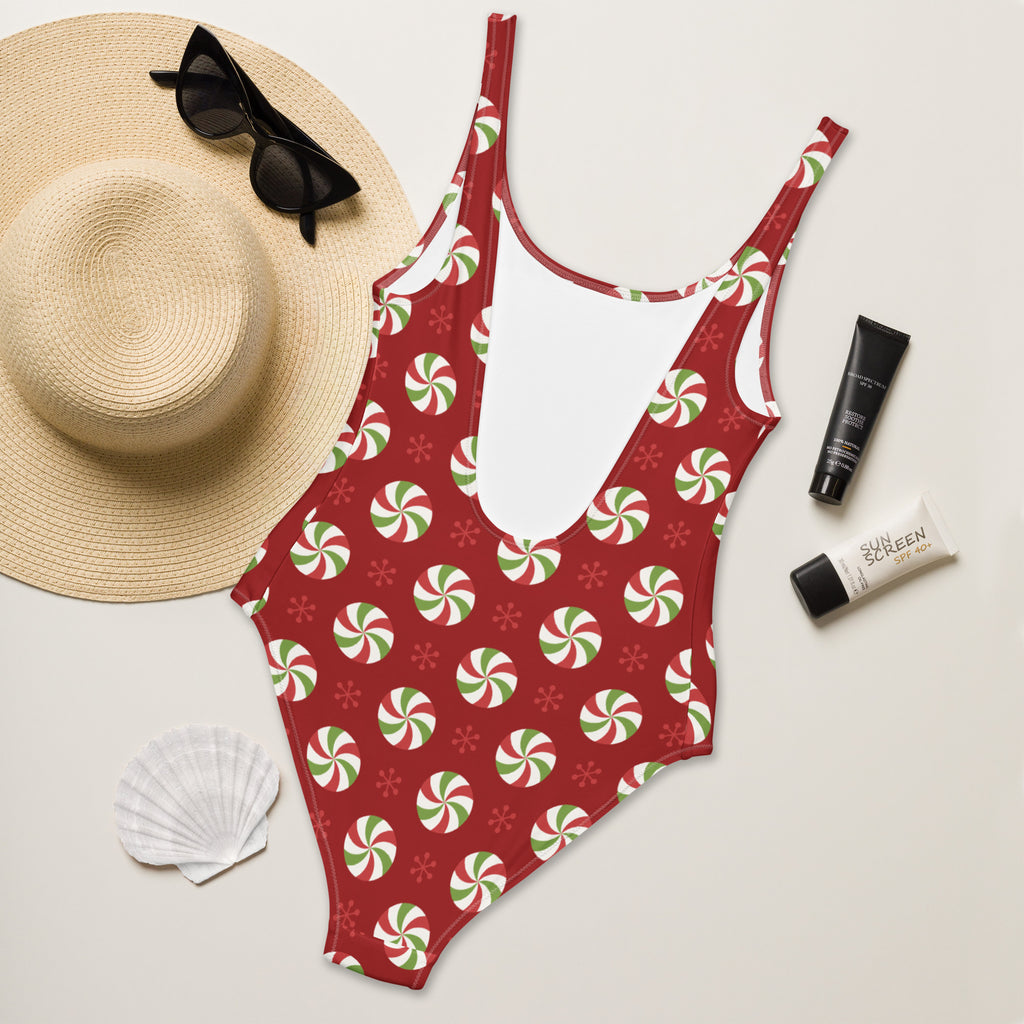 Red one-piece peppermint swirl Christmas swimsuit with buttery soft fabric and UPF 50 plus sun protection