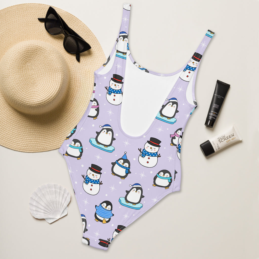 Lavender women’s cute penguin and snowman christmas buttery soft one-piece swimsuit with upf 50+ and winter accessories pattern