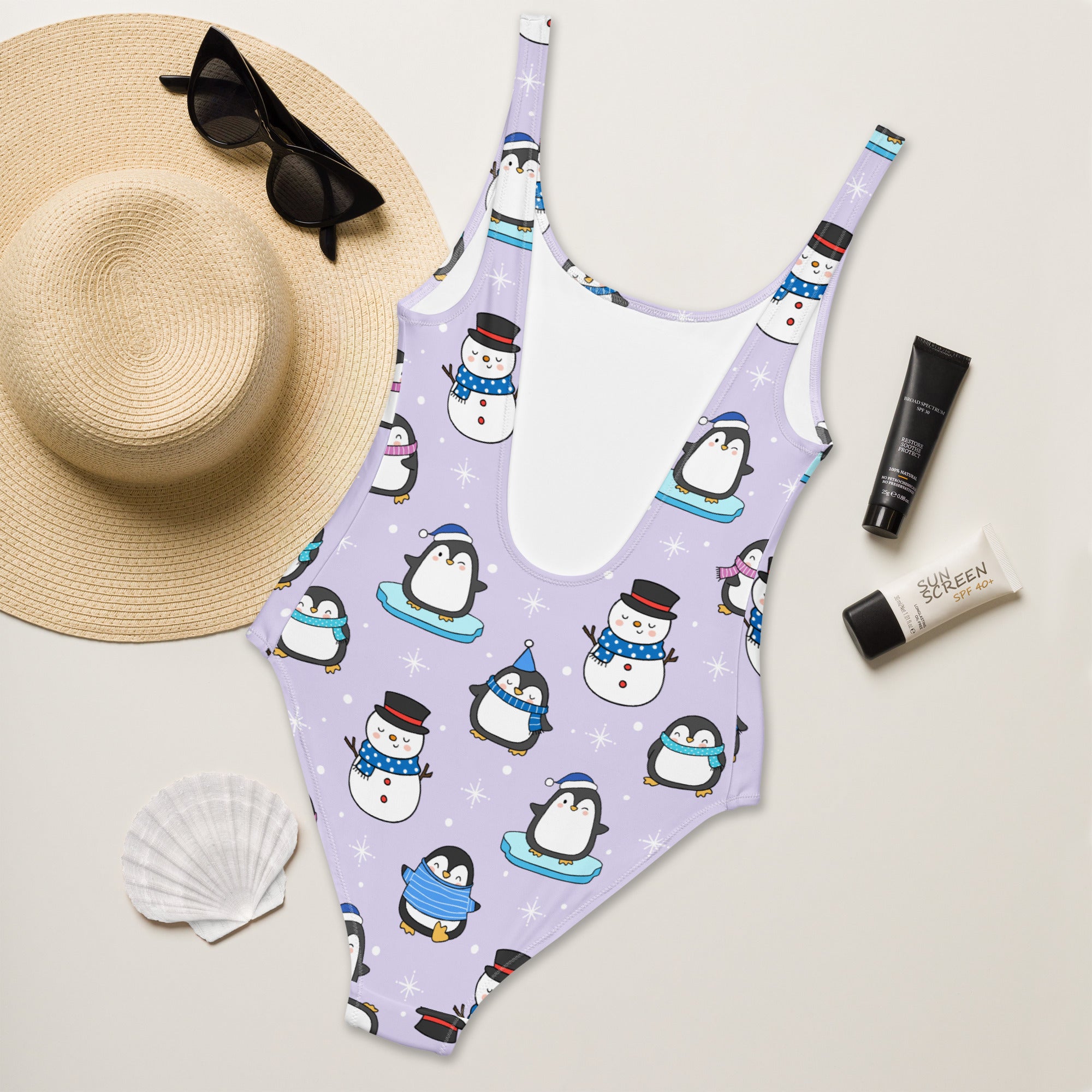 Lavender women’s cute penguin and snowman christmas buttery soft one-piece swimsuit with upf 50+ and winter accessories pattern