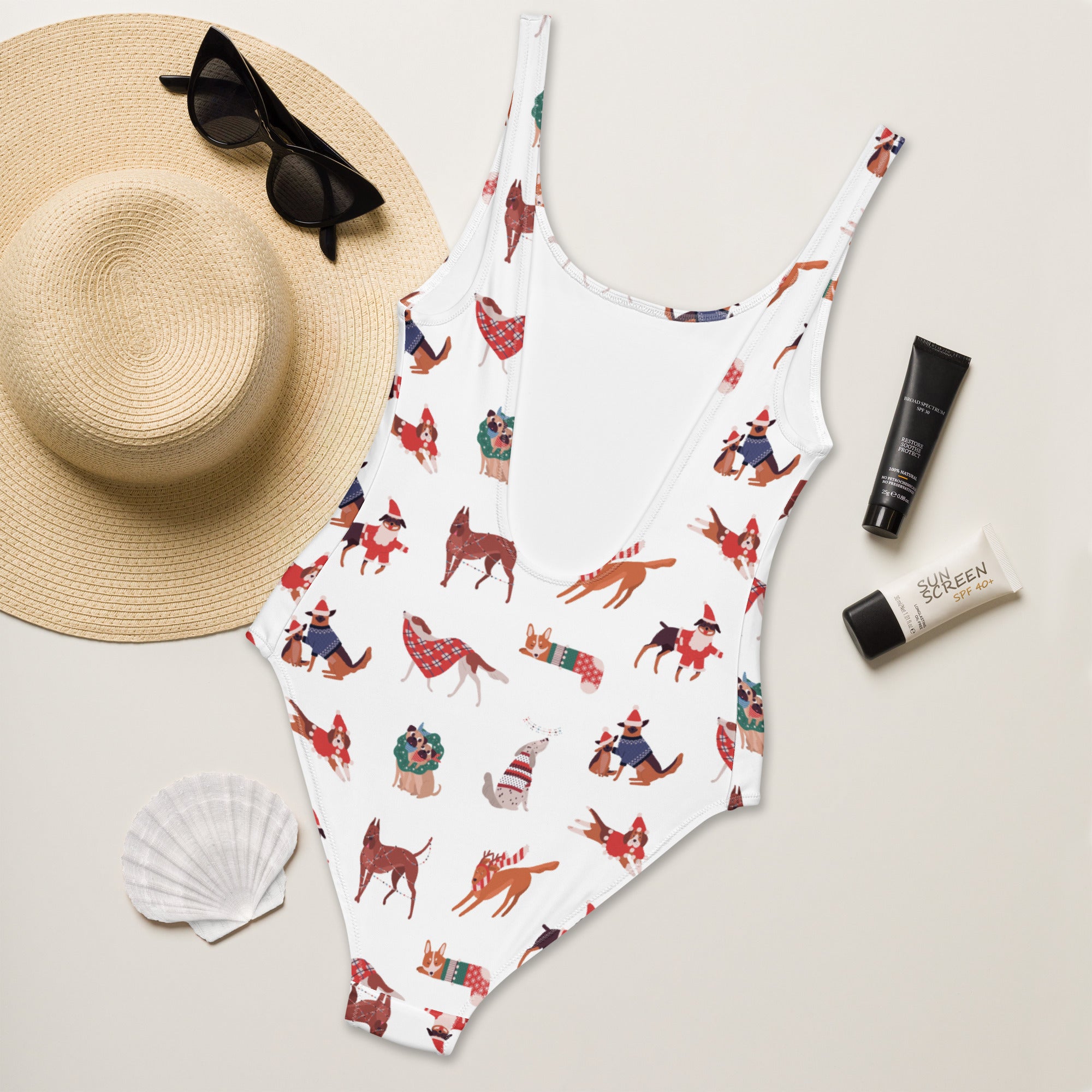 White one-piece swimsuit with buttery soft fabric and UPF 50 plus featuring festive cartoon dogs for women