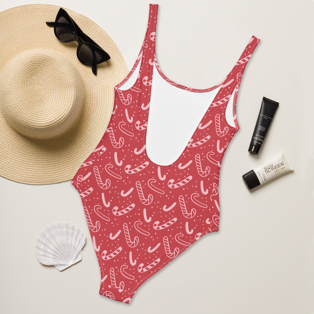 Women’s red candy cane one-piece Christmas swimsuit with thin straps buttery soft fabric and UPF 50 plus protection